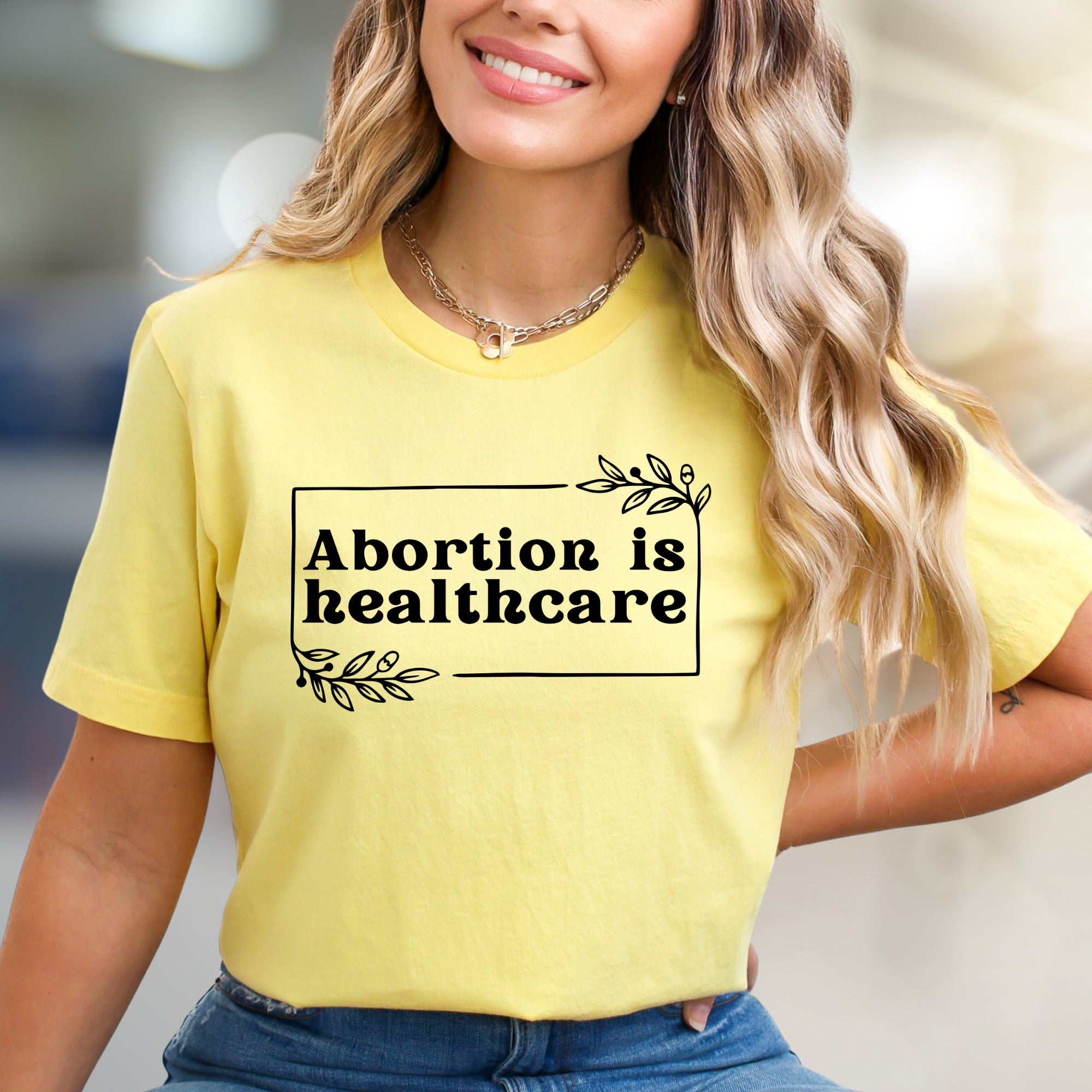 "Abortion is Healthcare" Botanical Frame Graphic Tee, a Statement Unisex Tee for Advocates
