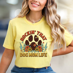 "ROCKIN' THAT DOG MOM LIFE" Retro Paw Print Graphic Tee, a Boho Chic Pick for Dog Lovers