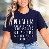 "NEVER UNDERESTIMATE THE POWER OF A GIRL WITH A BOOK -R.B.G" Empowerment Graphic Tee, a Feminist Pick for Readers