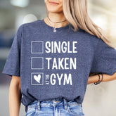 "Single, Taken, At The Gym" Workout Graphic Tee, a Fitness Humor Pick for Gym Lovers