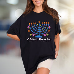 "Celebrate Hanukkah" Vibrant Menorah Graphic Tee, a Festive Holiday Pick for Enthusiasts