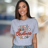 "Thick Thighs & Christmas Vibes" Retro Graphic Tee, a Festive Niche for Holiday Enthusiasts