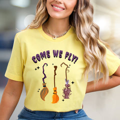 "COME WE FLY!" Witchy Broomstick Graphic Tee, a Spooky Chic Pick for Halloween Enthusiasts