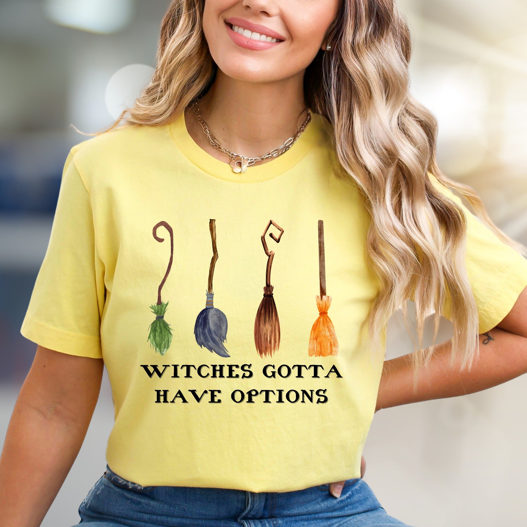 "Witches Gotta Have Options" Halloween Broomstick Graphic Tee, a Whimsical Pick for Halloween Enthusiasts