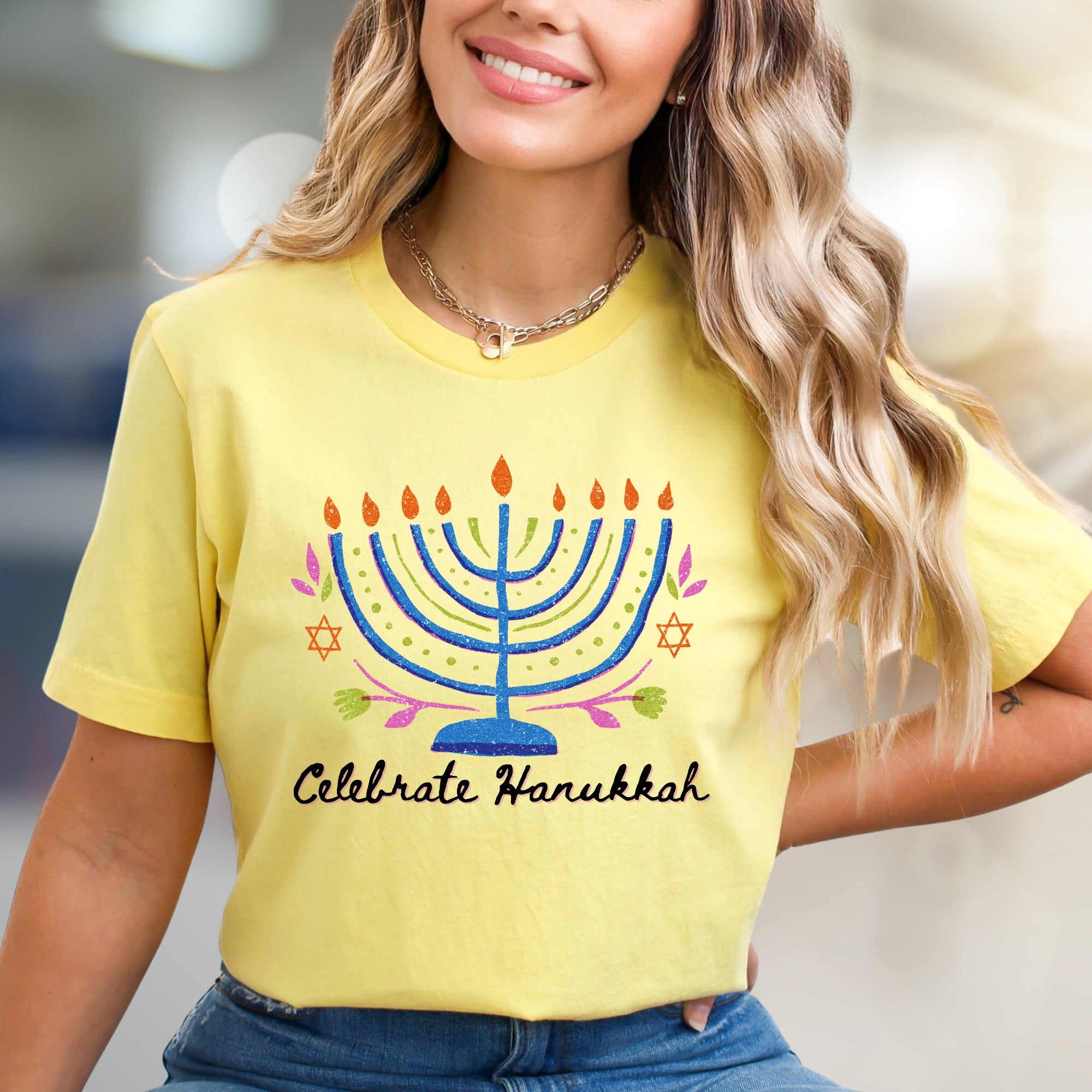"Celebrate Hanukkah" Vibrant Menorah Graphic Tee, a Festive Holiday Pick for Enthusiasts