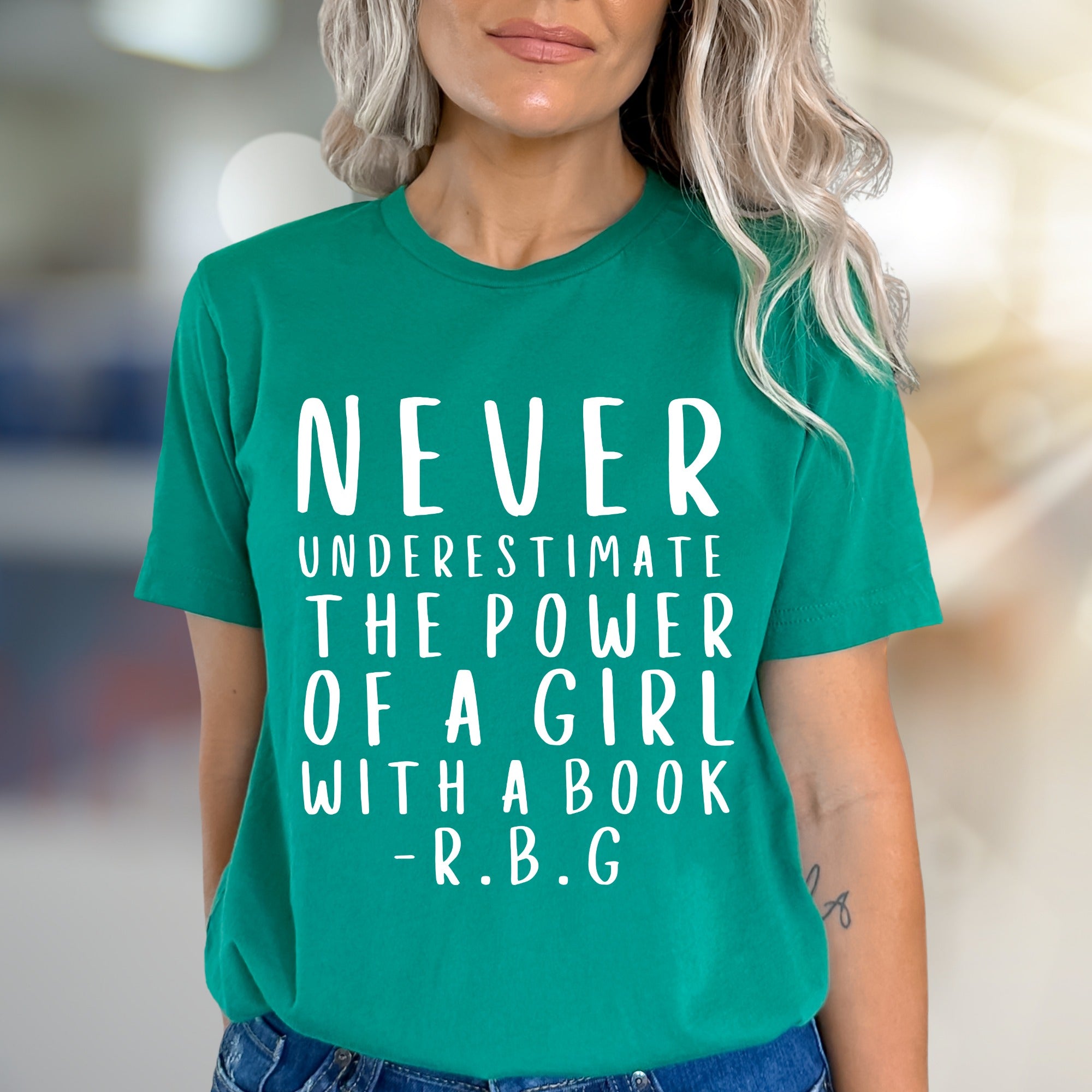"NEVER UNDERESTIMATE THE POWER OF A GIRL WITH A BOOK -R.B.G" Empowerment Graphic Tee, a Feminist Pick for Readers