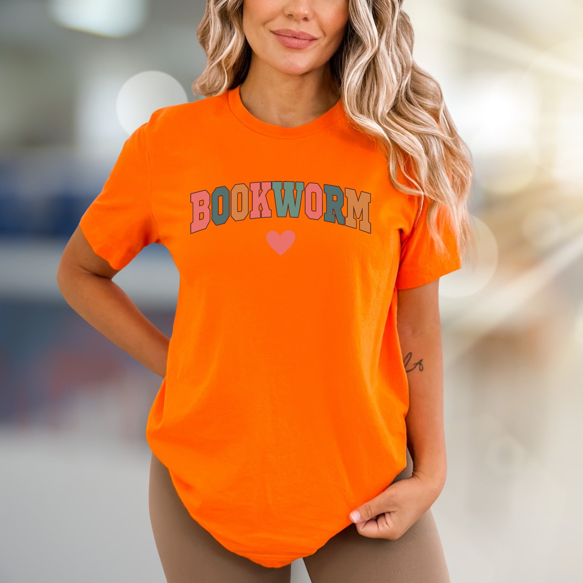 "BOOKWORM" Playful Arch Graphic Tee, a Literary Enthusiast's Everyday Style