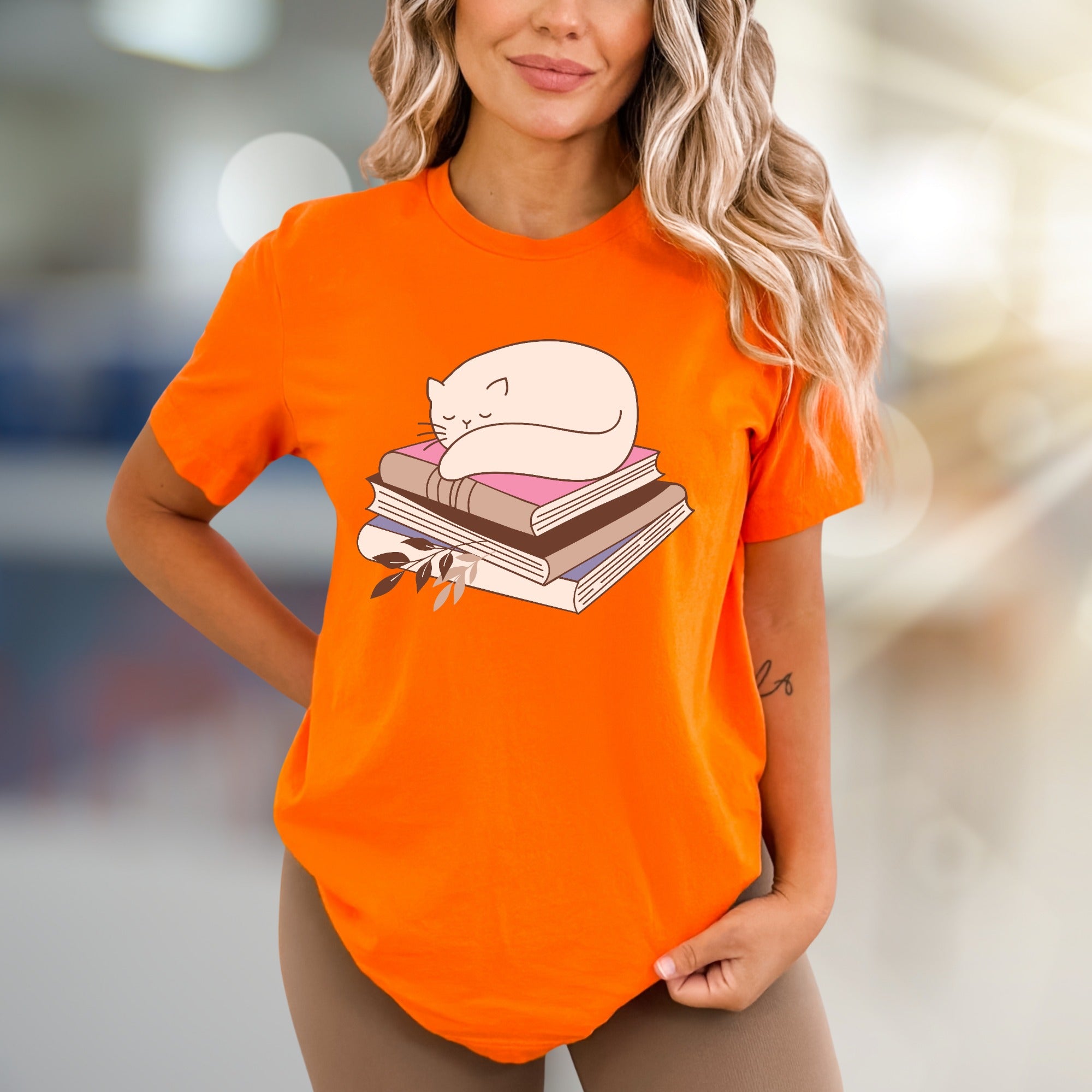 Sleeping Cat on Books Graphic Tee, a Cozy Literary Pick for Book Lovers