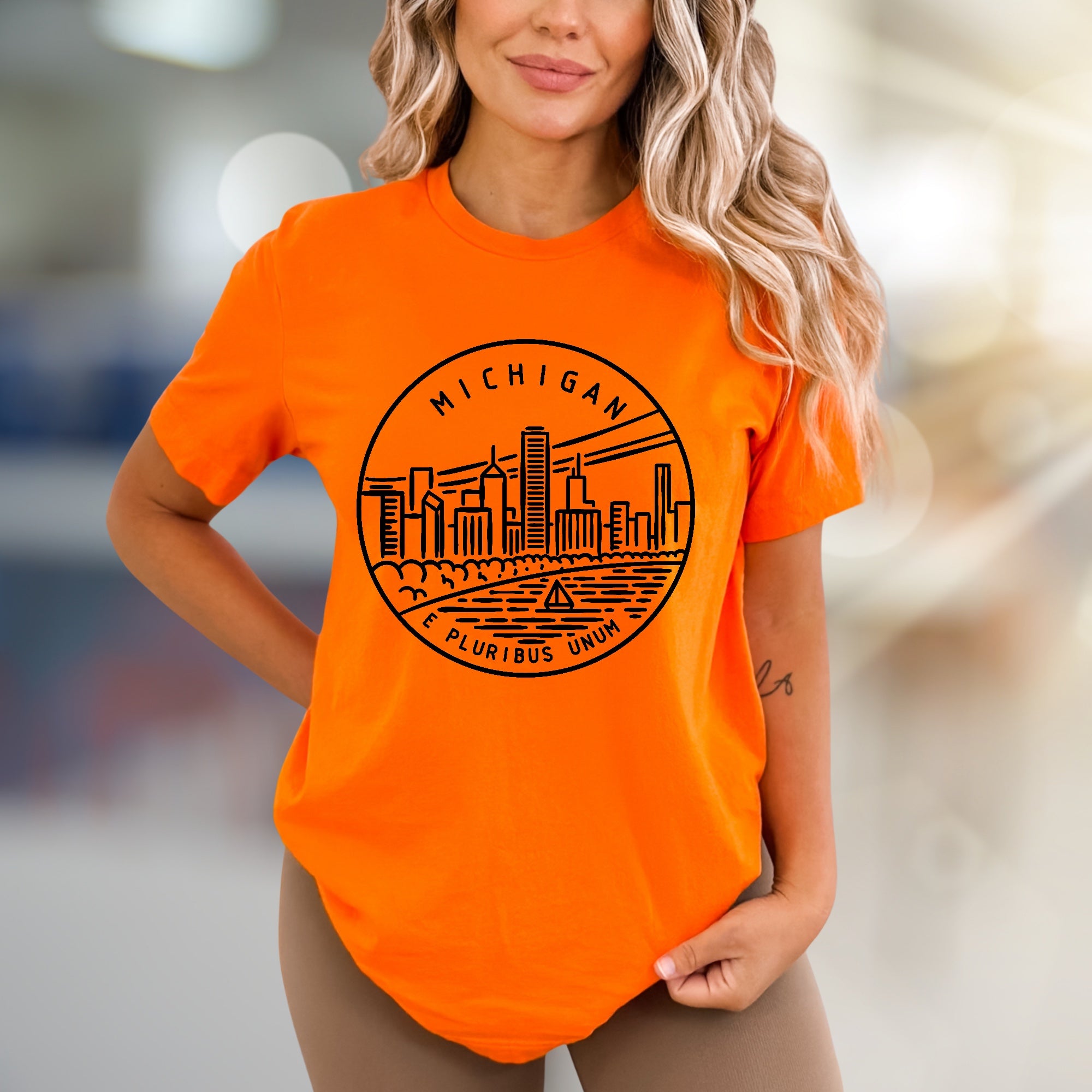 "MICHIGAN E PLURIBUS UNUM" Cityscape Graphic Tee, a State Pride Pick for Travel Enthusiasts