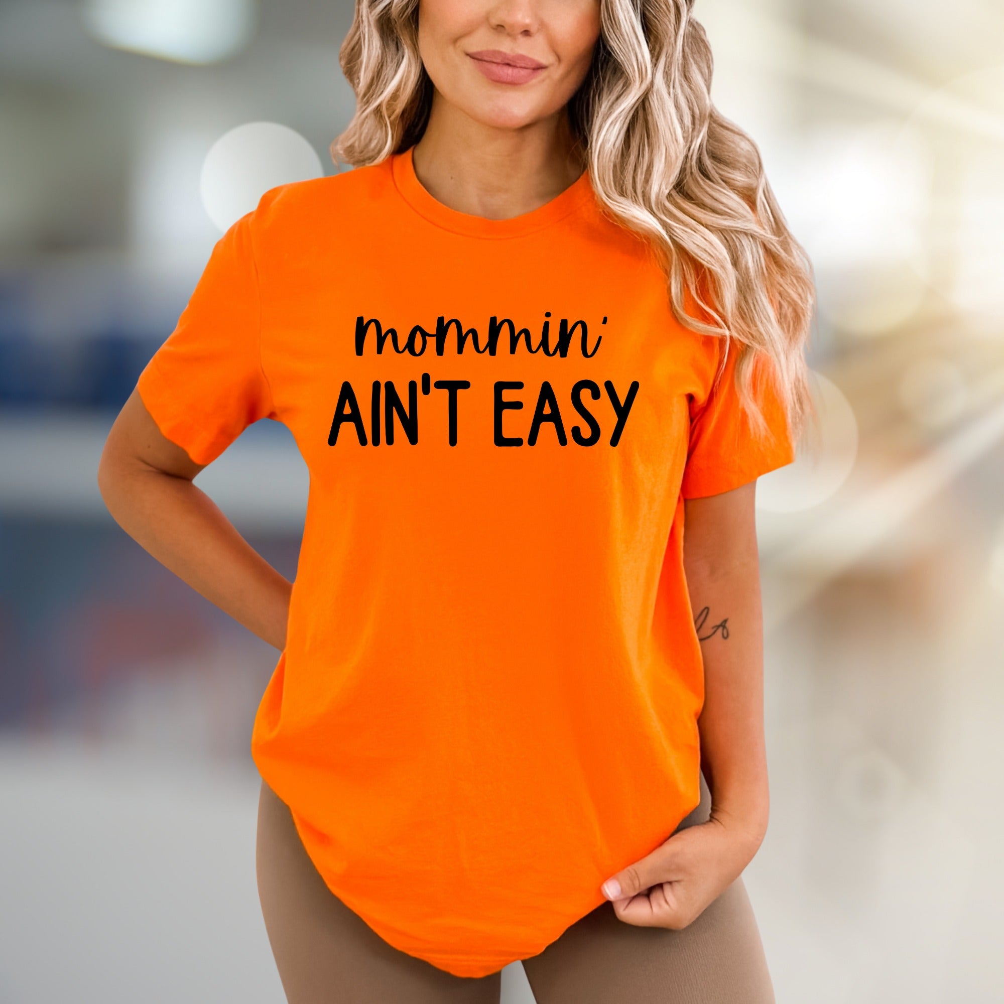 "Mommin' Ain't Easy" Humorous Graphic Tee, a Relatable Pick for Moms