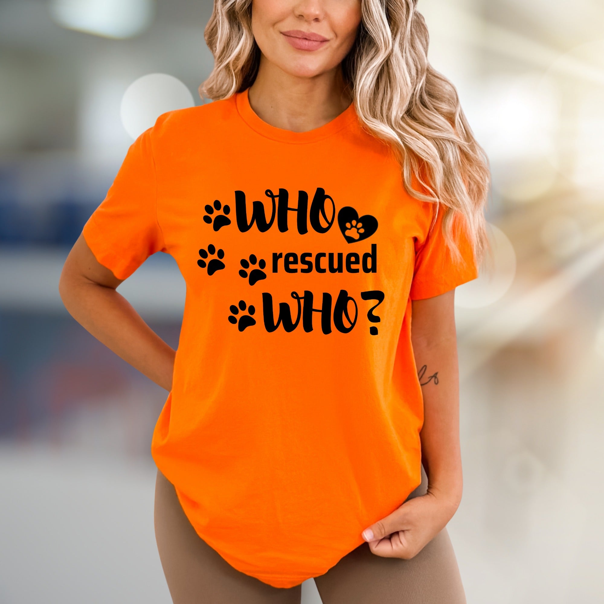 "WHO rescued WHO?" Paw Print Graphic Tee, a Heartfelt Pick for Pet Lovers
