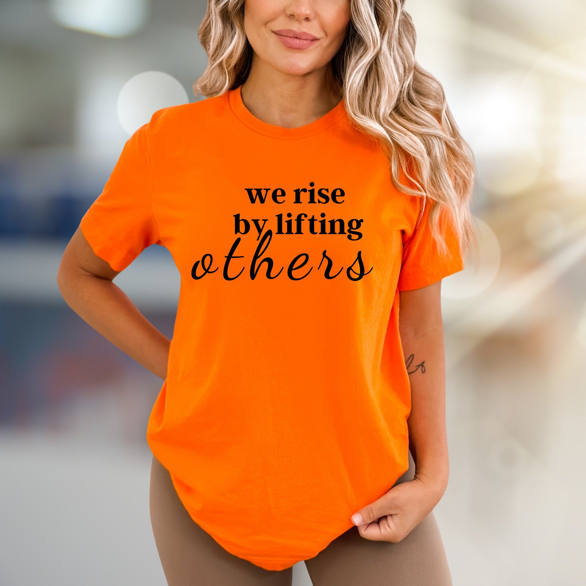 "We Rise by Lifting Others" Inspirational Graphic Tee, a Compassionate Pick for Everyday Wear