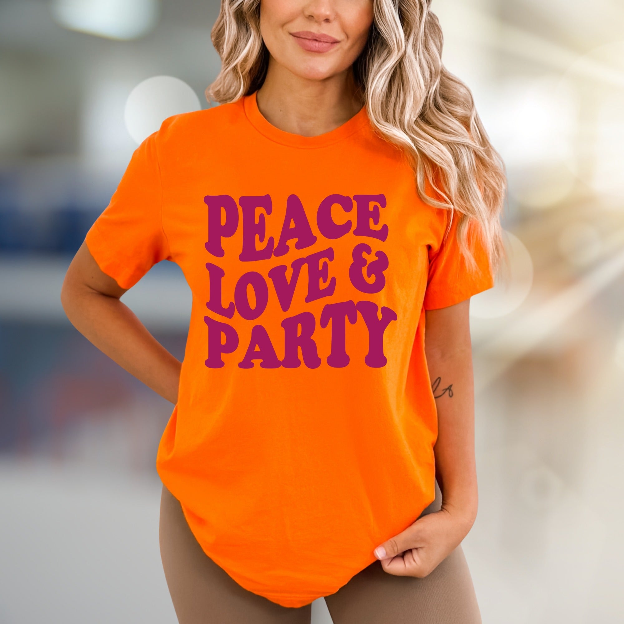 "Peace Love & Party" Groovy Graphic Tee, a Retro-Vibe Pick for Free Spirits