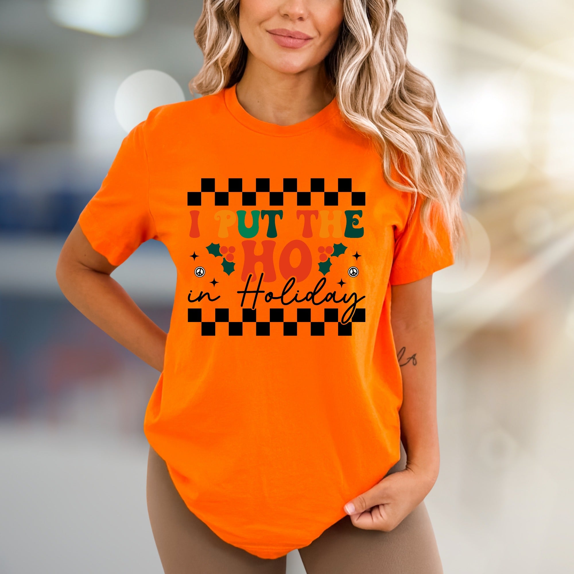 "I Put The HO In Holiday" Retro Checkered Graphic Tee, a Festive Niche for Holiday Enthusiasts