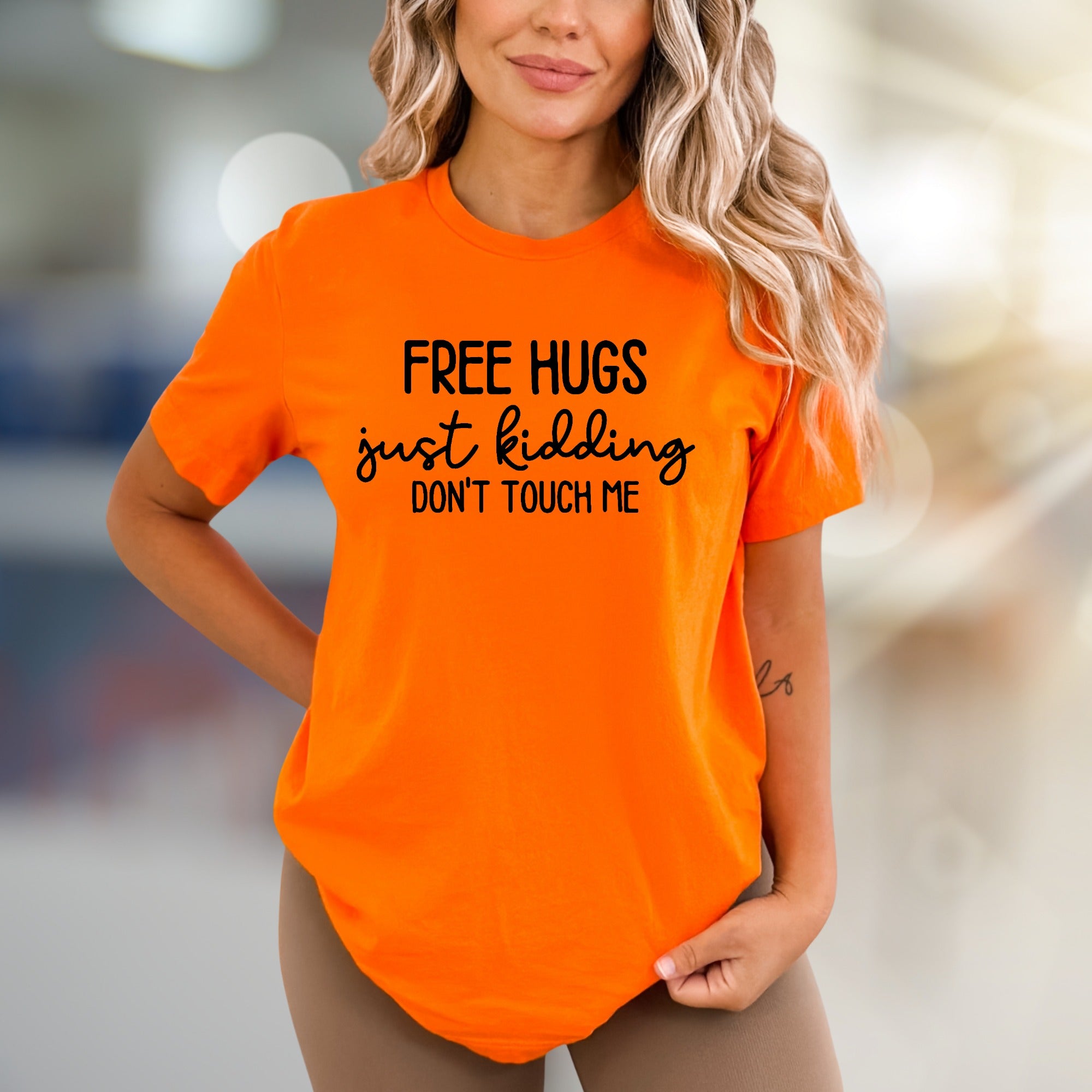 "FREE HUGS just kidding DON'T TOUCH ME" Sarcastic Graphic Tee, A Playful Individual's Pick