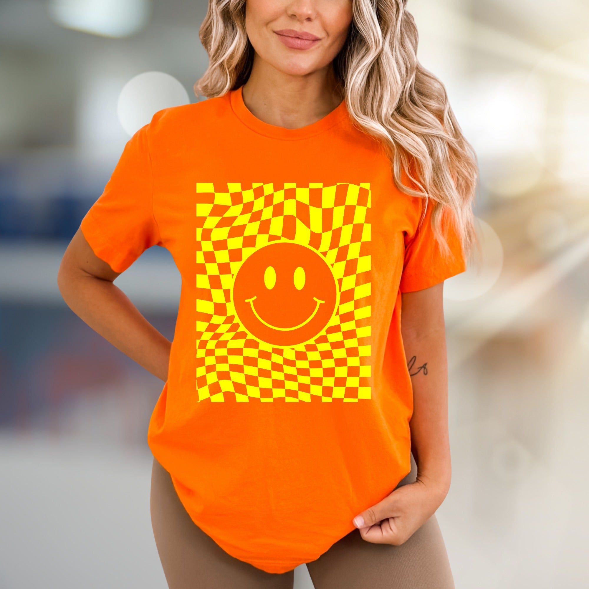 Warped Checkerboard Smiley Graphic Tee, A Retro-Inspired Pick for Free Spirits