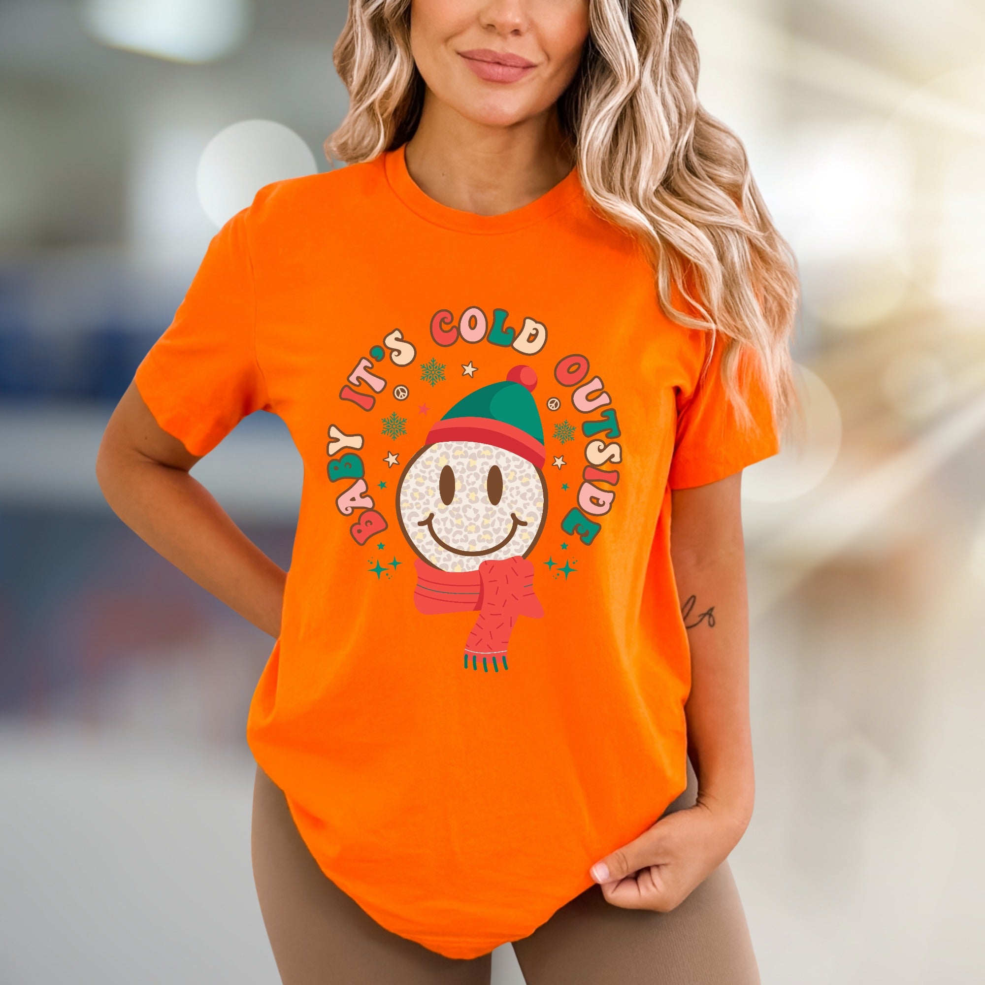 "Baby It's Cold Outside" Winter Smiley Graphic Tee, a Festive Comfort Pick for Holiday Lovers