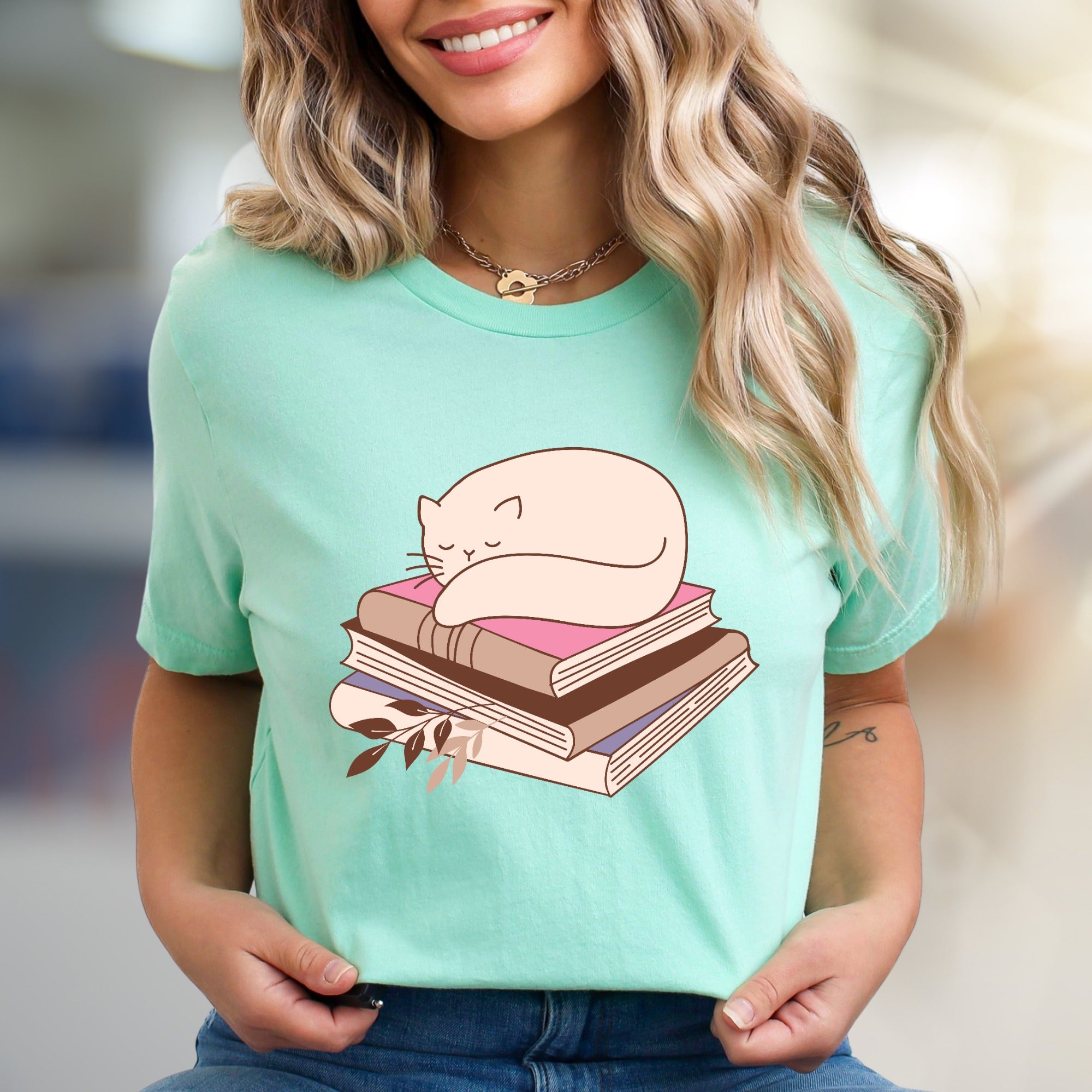 Sleeping Cat on Books Graphic Tee, a Cozy Literary Pick for Book Lovers