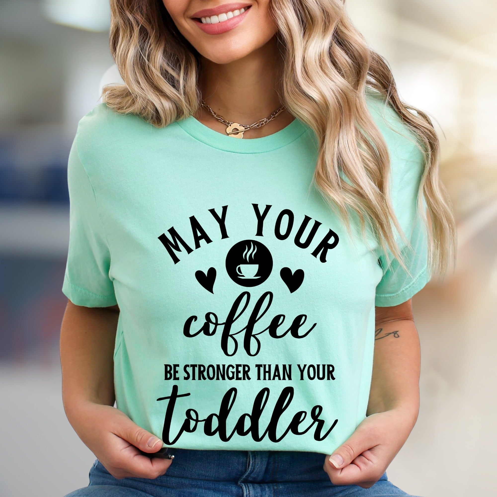 "May Your Coffee Be Stronger Than Your Toddler" Graphic Tee, a Parent Humor Pick for Coffee Lovers