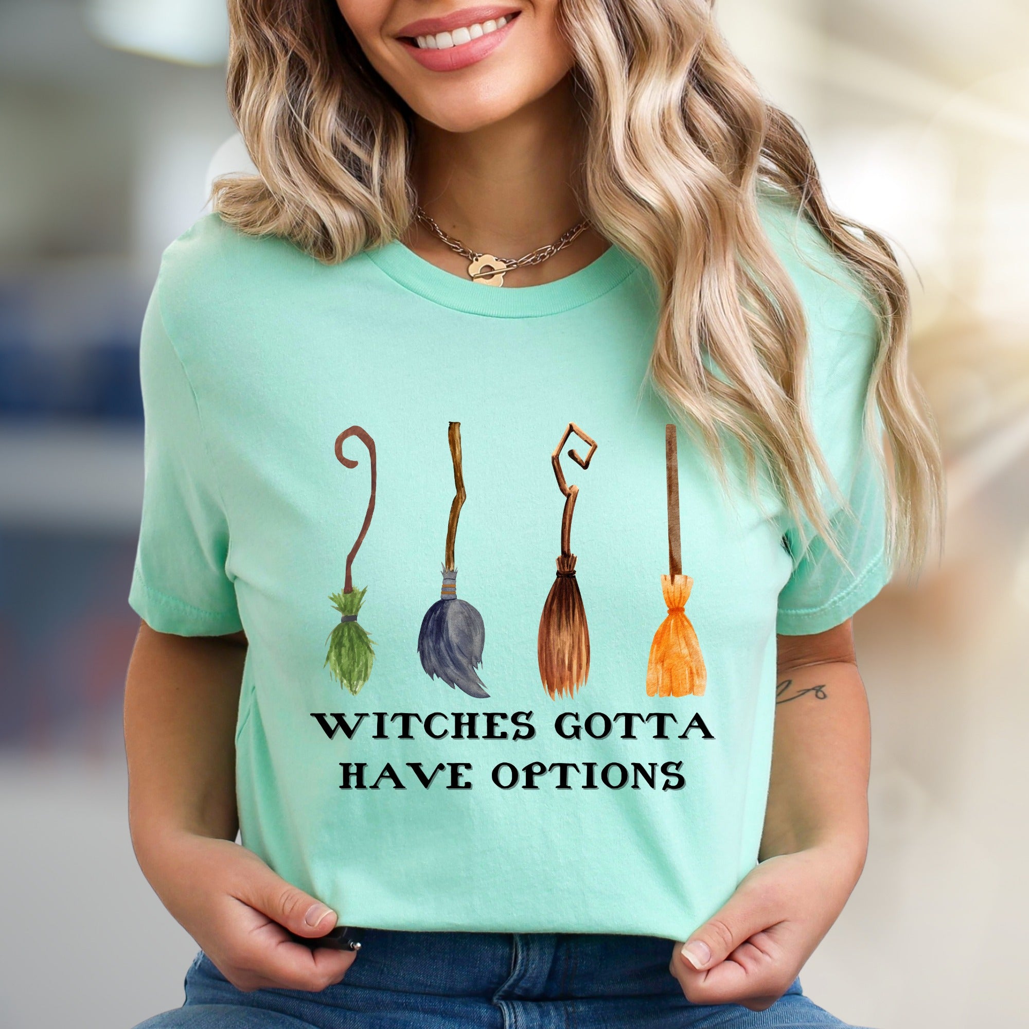 "Witches Gotta Have Options" Halloween Broomstick Graphic Unisex Tee, a Witchy Pick for Spooky Season Enthusiasts