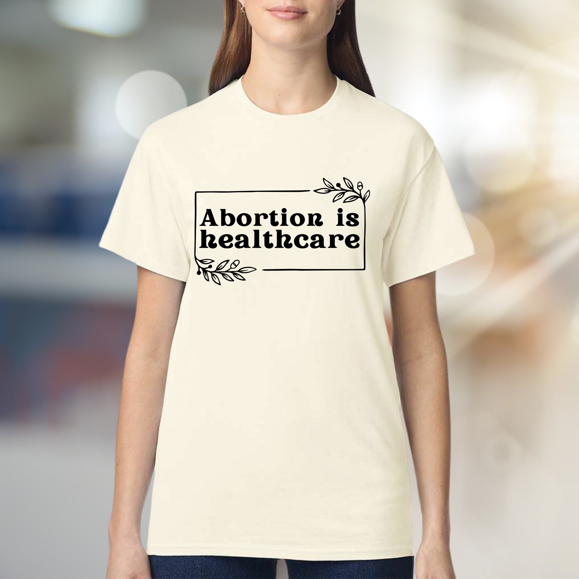 "Abortion is Healthcare" Botanical Frame Graphic Tee, a Statement Unisex Tee for Advocates
