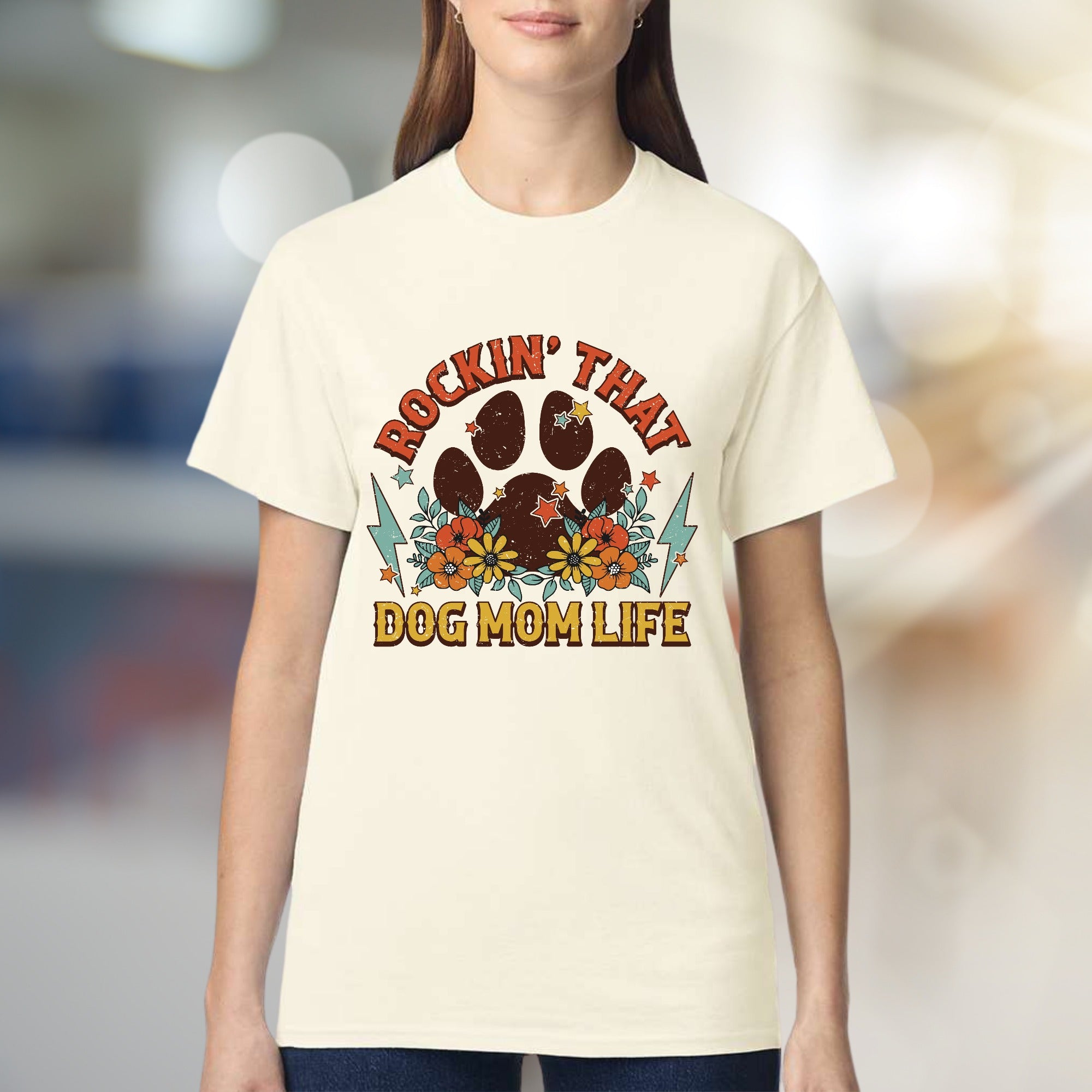 "ROCKIN' THAT DOG MOM LIFE" Retro Paw Print Graphic Tee, a Boho Chic Pick for Dog Lovers