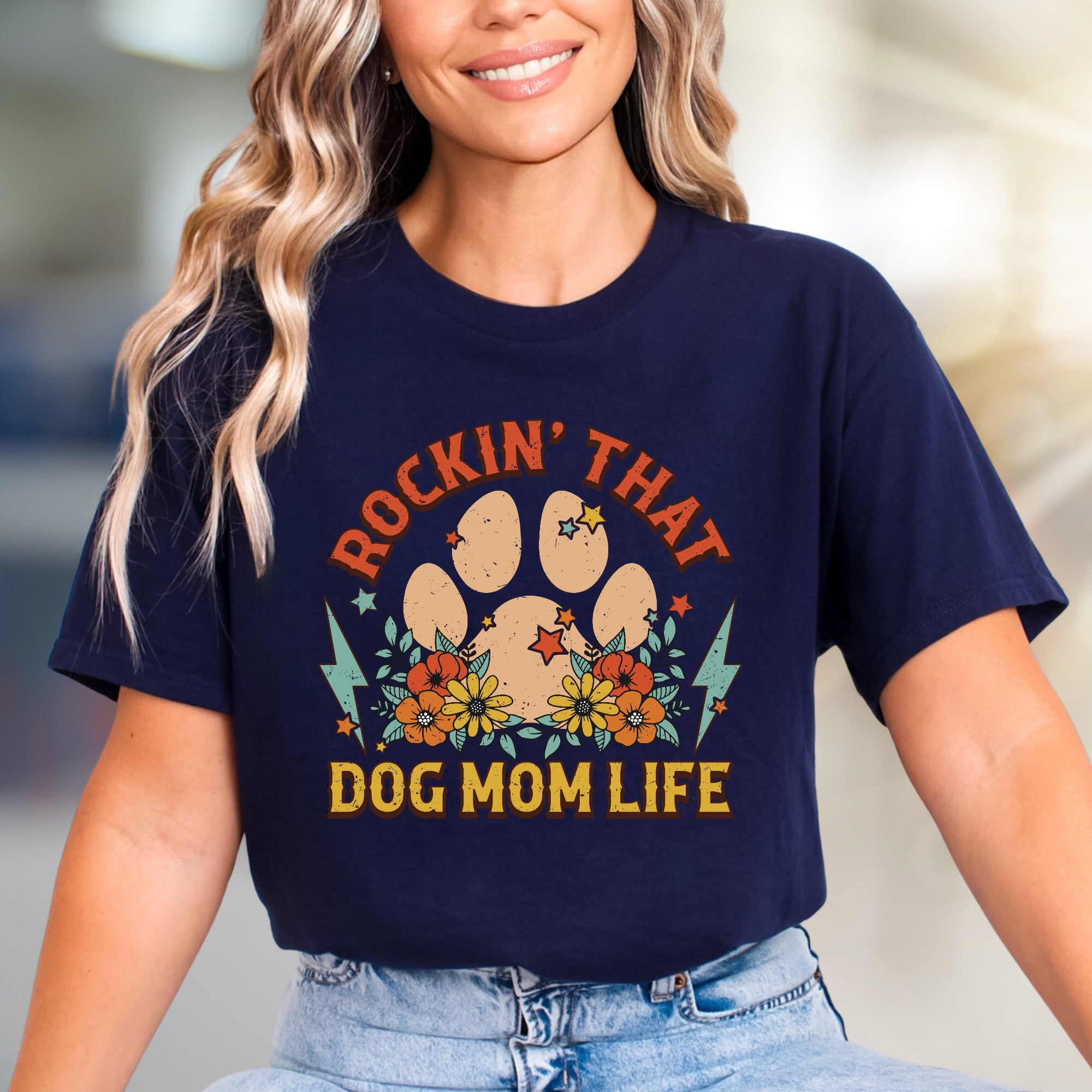 "ROCKIN' THAT DOG MOM LIFE" Retro Paw Print Graphic Tee, a Boho Chic Pick for Dog Lovers