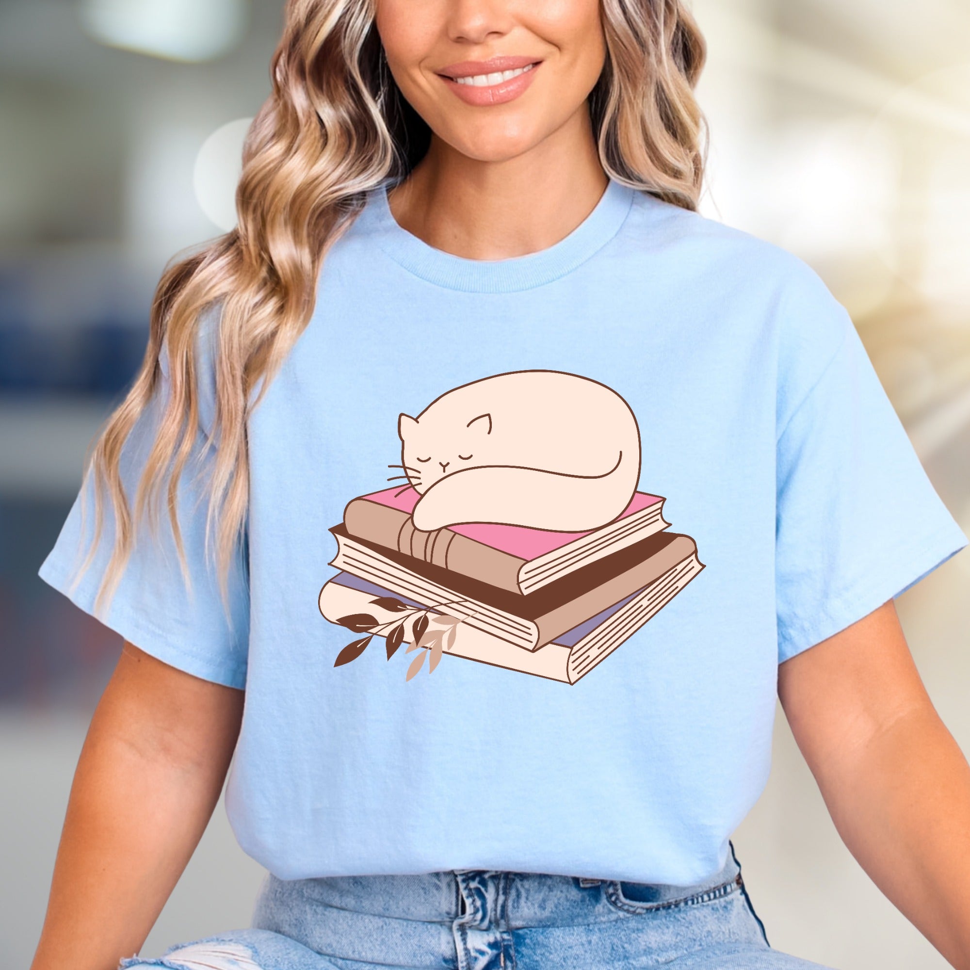 Sleeping Cat on Books Graphic Tee, a Cozy Literary Pick for Book Lovers