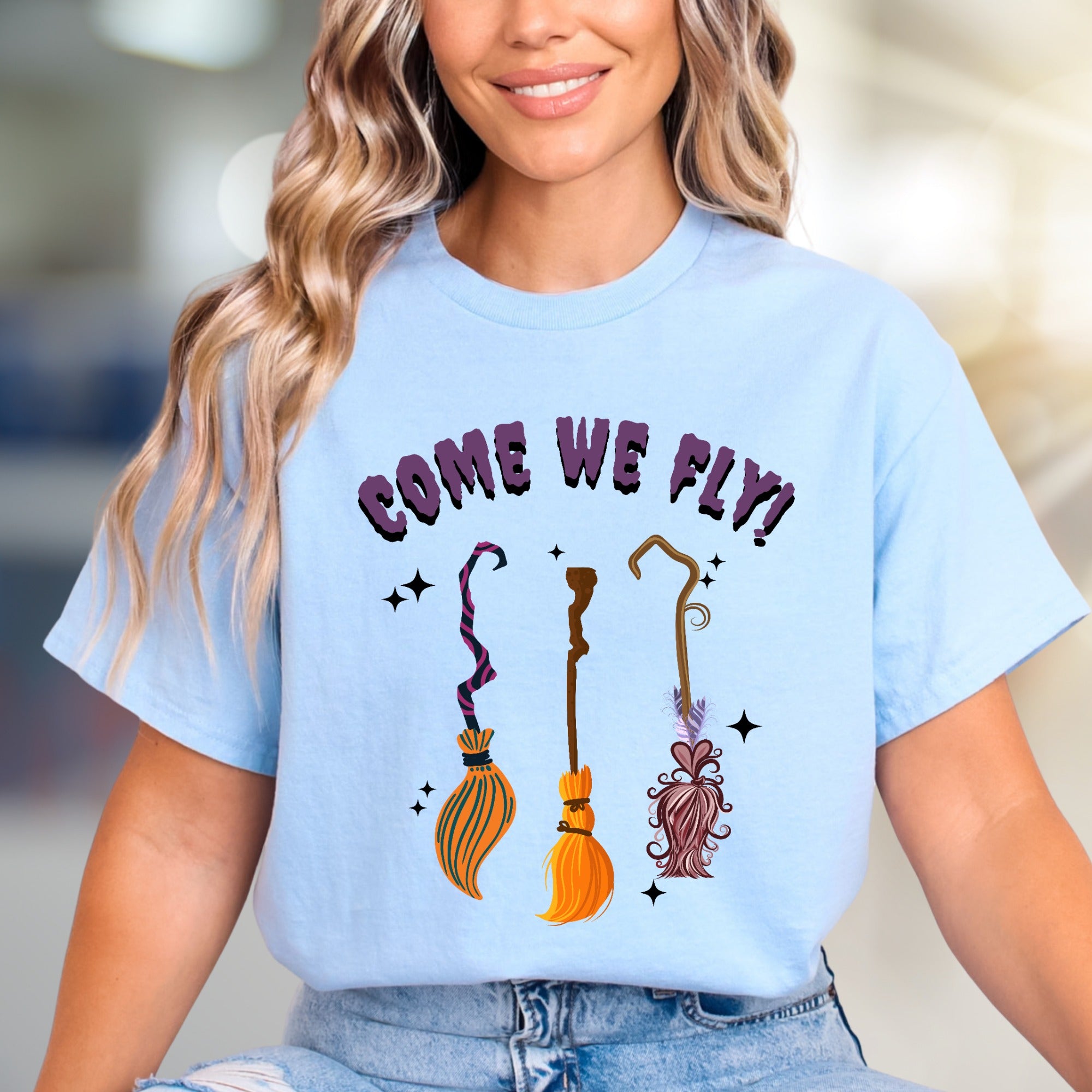 "COME WE FLY!" Witchy Broomstick Graphic Tee, a Spooky Chic Pick for Halloween Enthusiasts