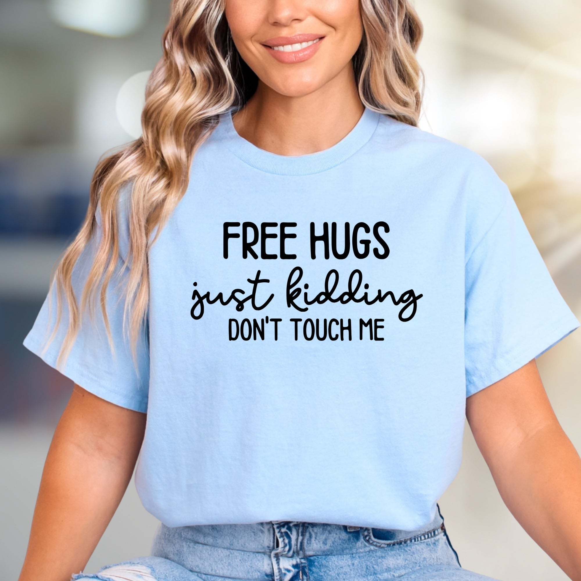 "FREE HUGS just kidding DON'T TOUCH ME" Sarcastic Graphic Tee, A Humorous Pick for Introverts
