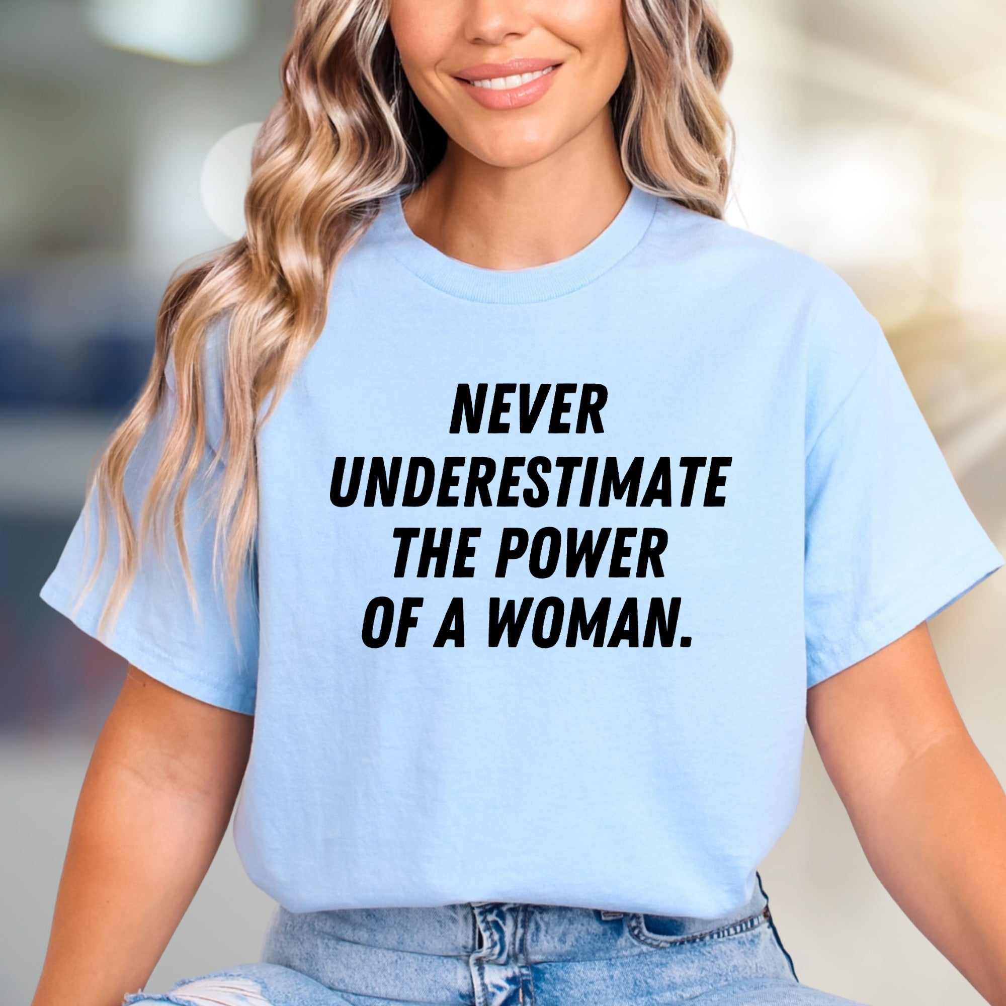 "NEVER UNDERESTIMATE THE POWER OF A WOMAN." Empowering Graphic Tee, a Bold Statement for Her