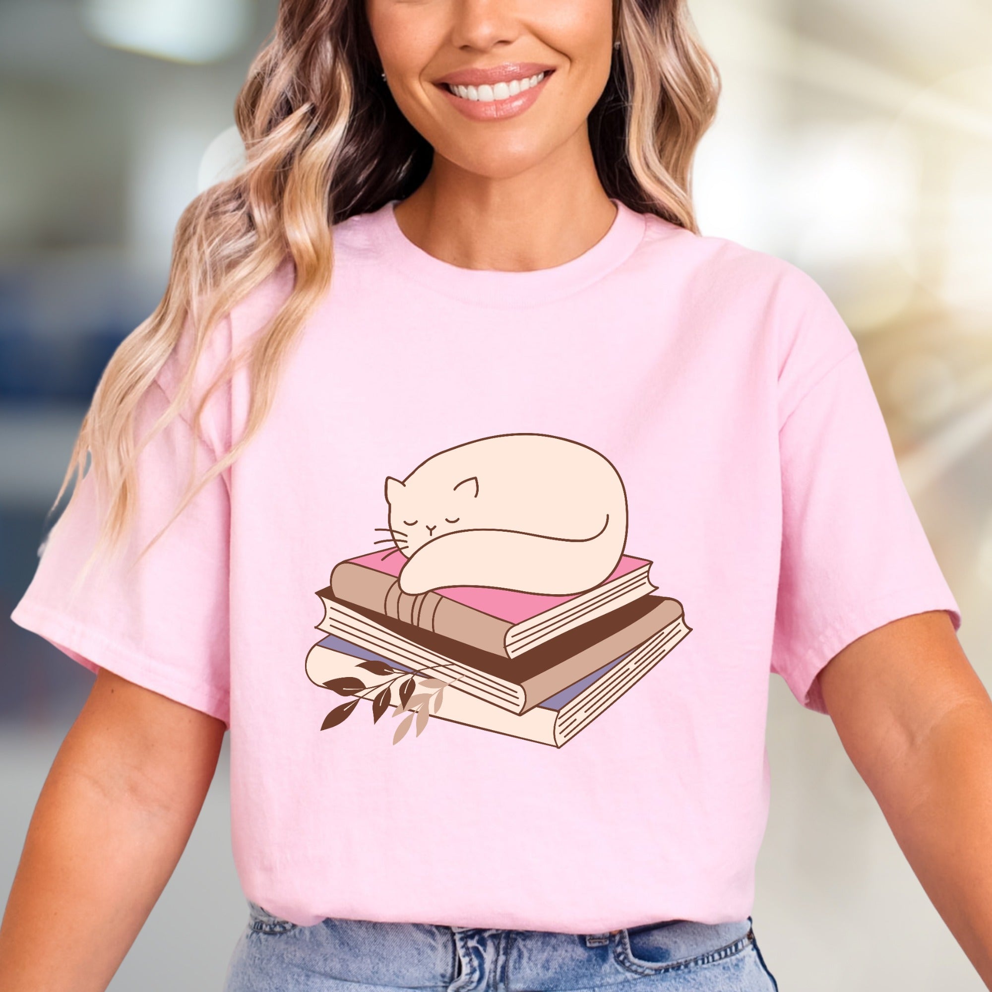 Sleeping Cat on Books Graphic Tee, a Cozy Literary Pick for Book Lovers
