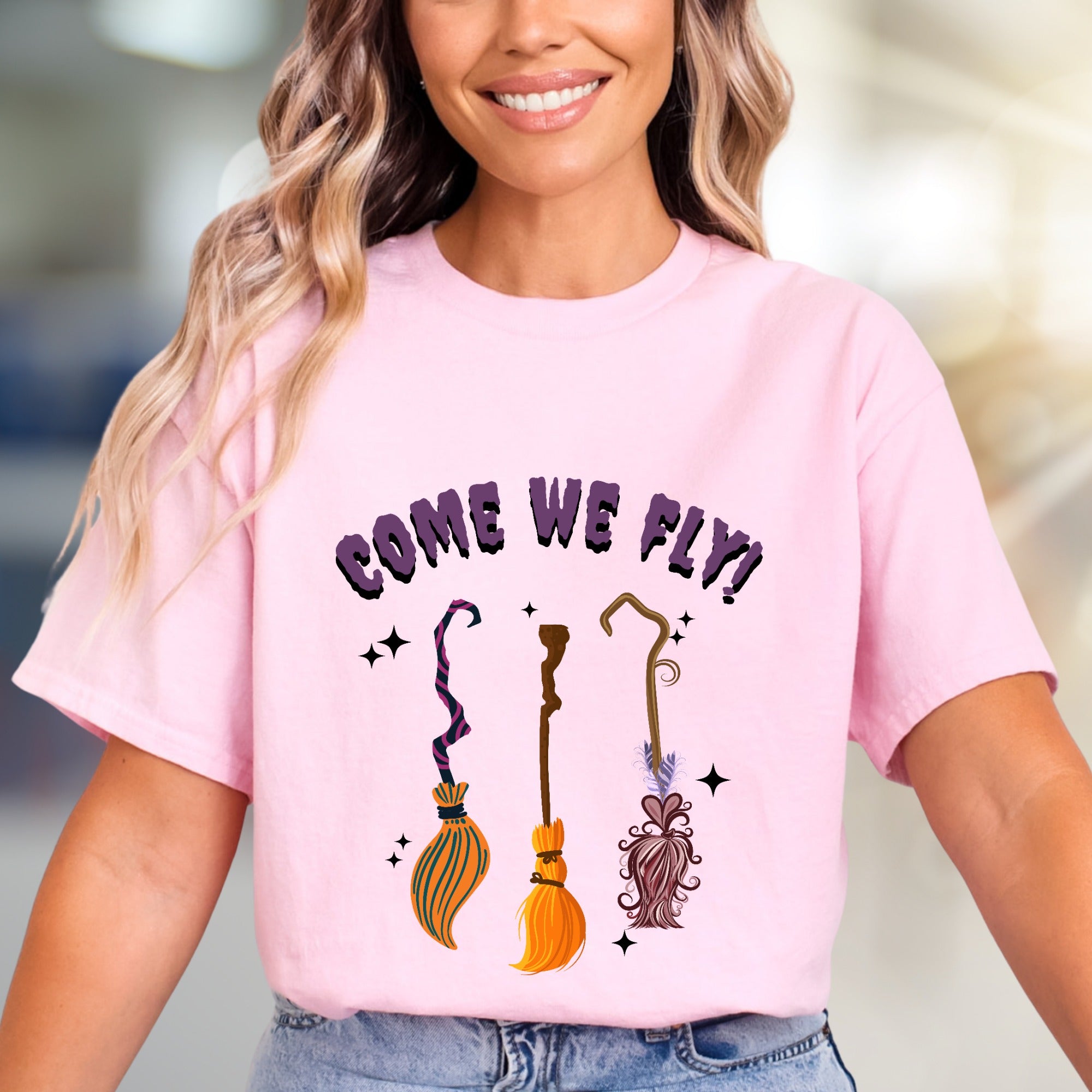 "COME WE FLY!" Witchy Broomstick Graphic Tee, a Spooky Chic Pick for Halloween Enthusiasts