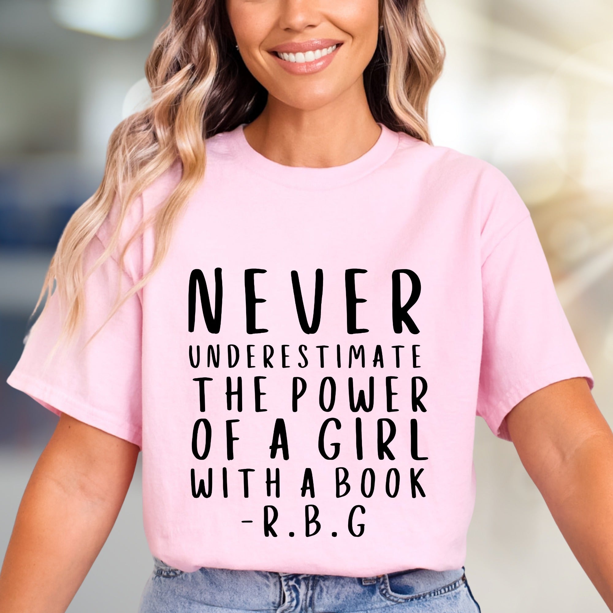 "NEVER UNDERESTIMATE THE POWER OF A GIRL WITH A BOOK -R.B.G" Empowerment Graphic Tee, a Feminist Pick for Readers