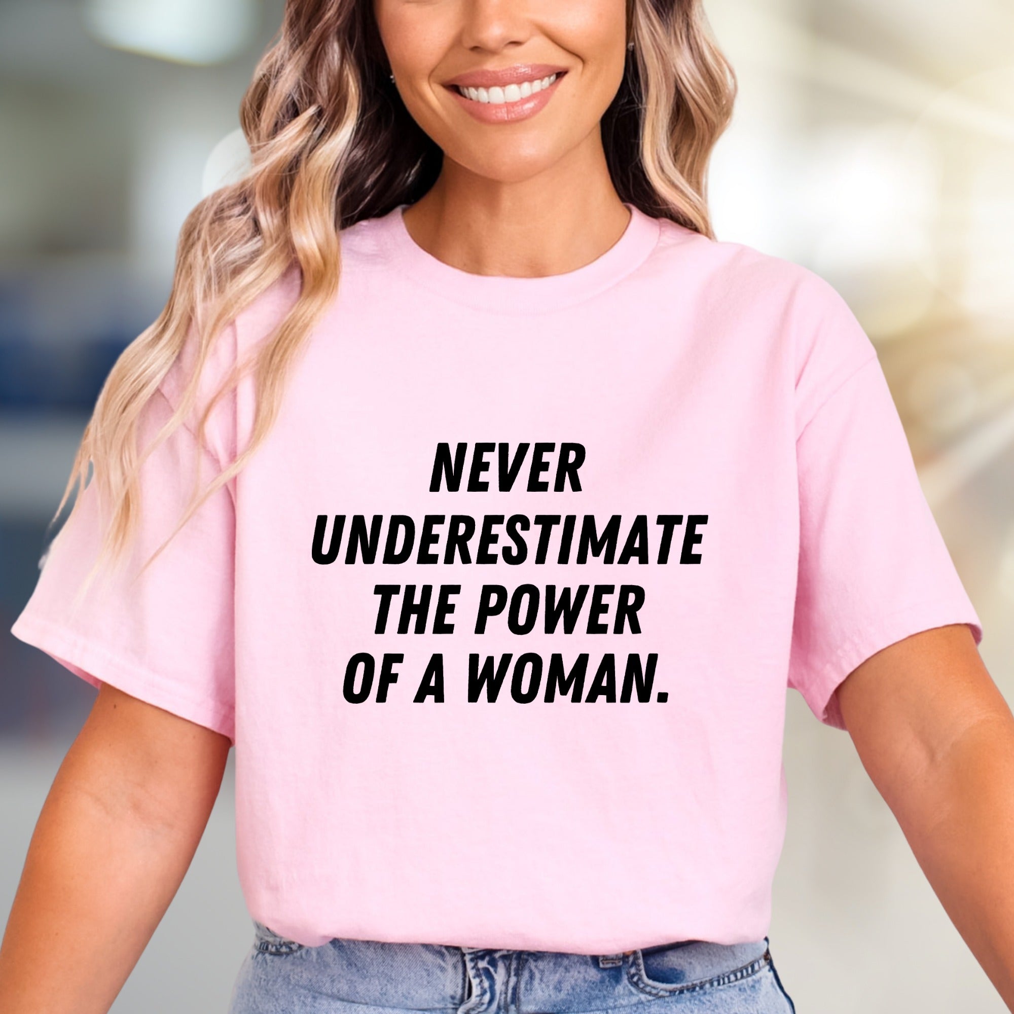"NEVER UNDERESTIMATE THE POWER OF A WOMAN." Empowering Graphic Tee, a Bold Statement for Her