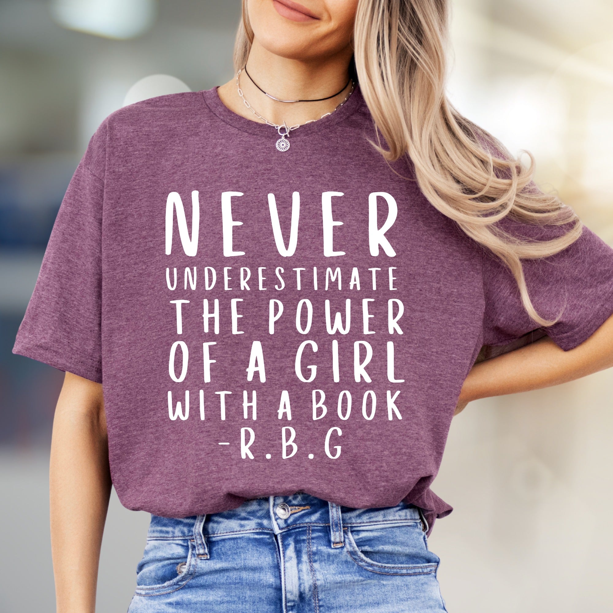 "NEVER UNDERESTIMATE THE POWER OF A GIRL WITH A BOOK -R.B.G" Empowerment Graphic Tee, a Feminist Pick for Readers