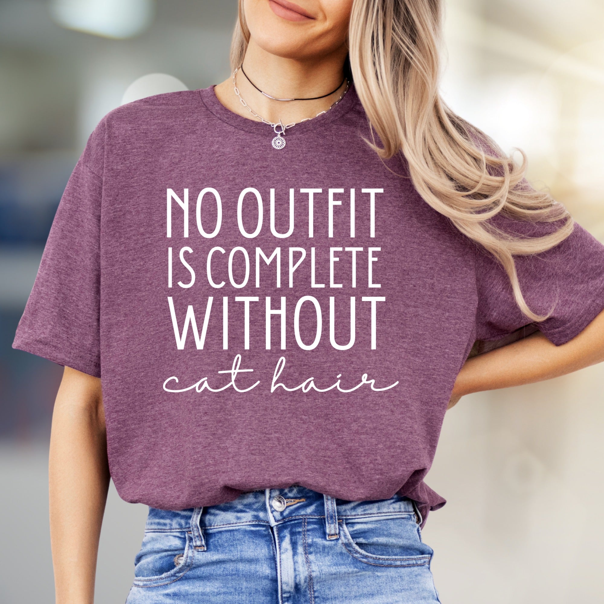 "NO OUTFIT IS COMPLETE WITHOUT cat hair" Humorous Cat Lover Graphic Tee, a Witty Lifestyle Pick for Pet Owners