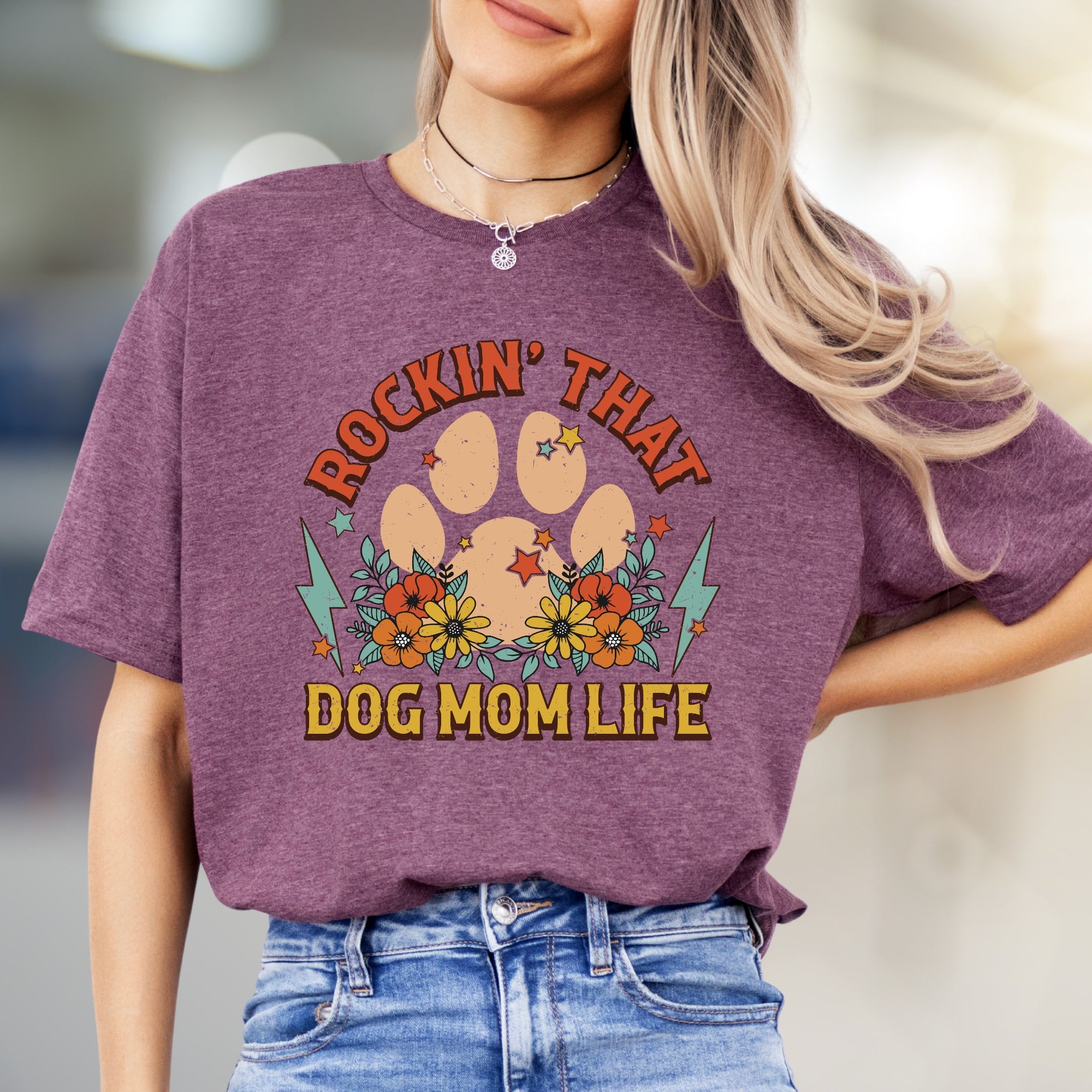 "ROCKIN' THAT DOG MOM LIFE" Retro Paw Print Graphic Tee, a Boho Chic Pick for Dog Lovers