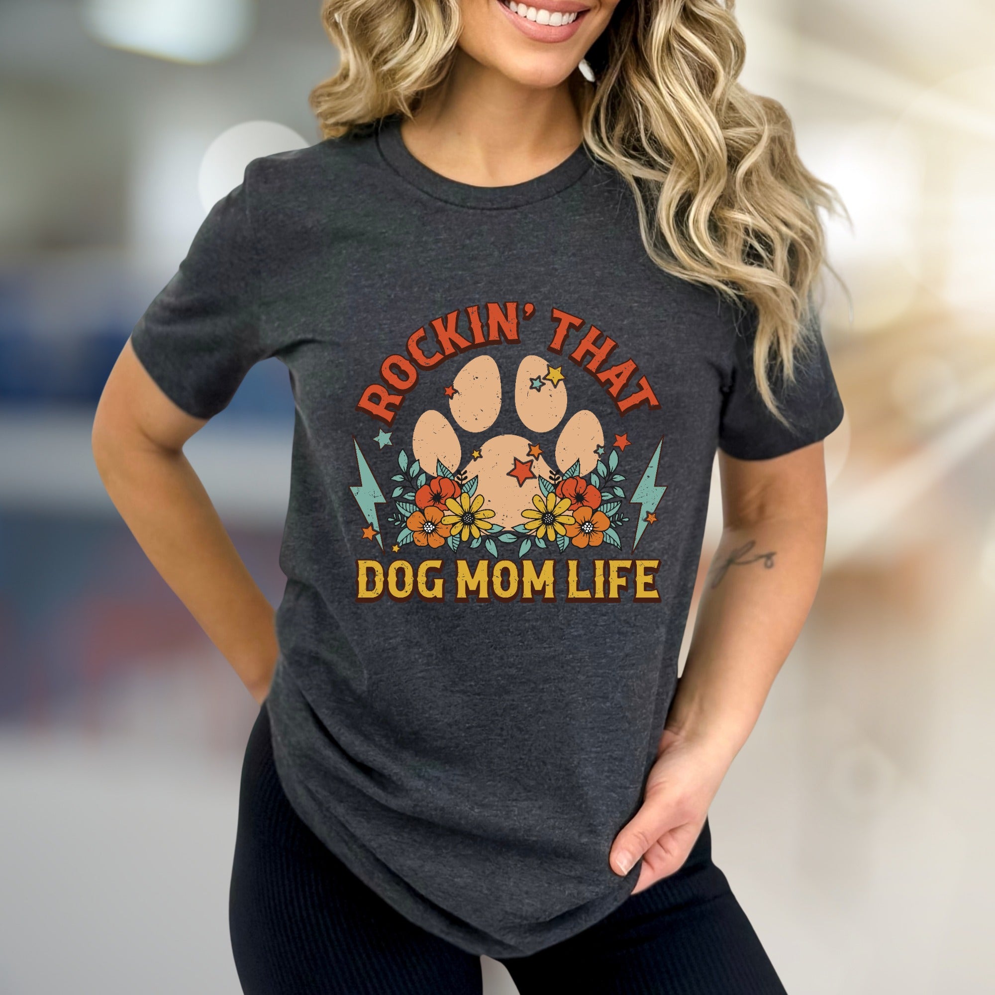 "ROCKIN' THAT DOG MOM LIFE" Retro Paw Print Graphic Tee, a Boho Chic Pick for Dog Lovers