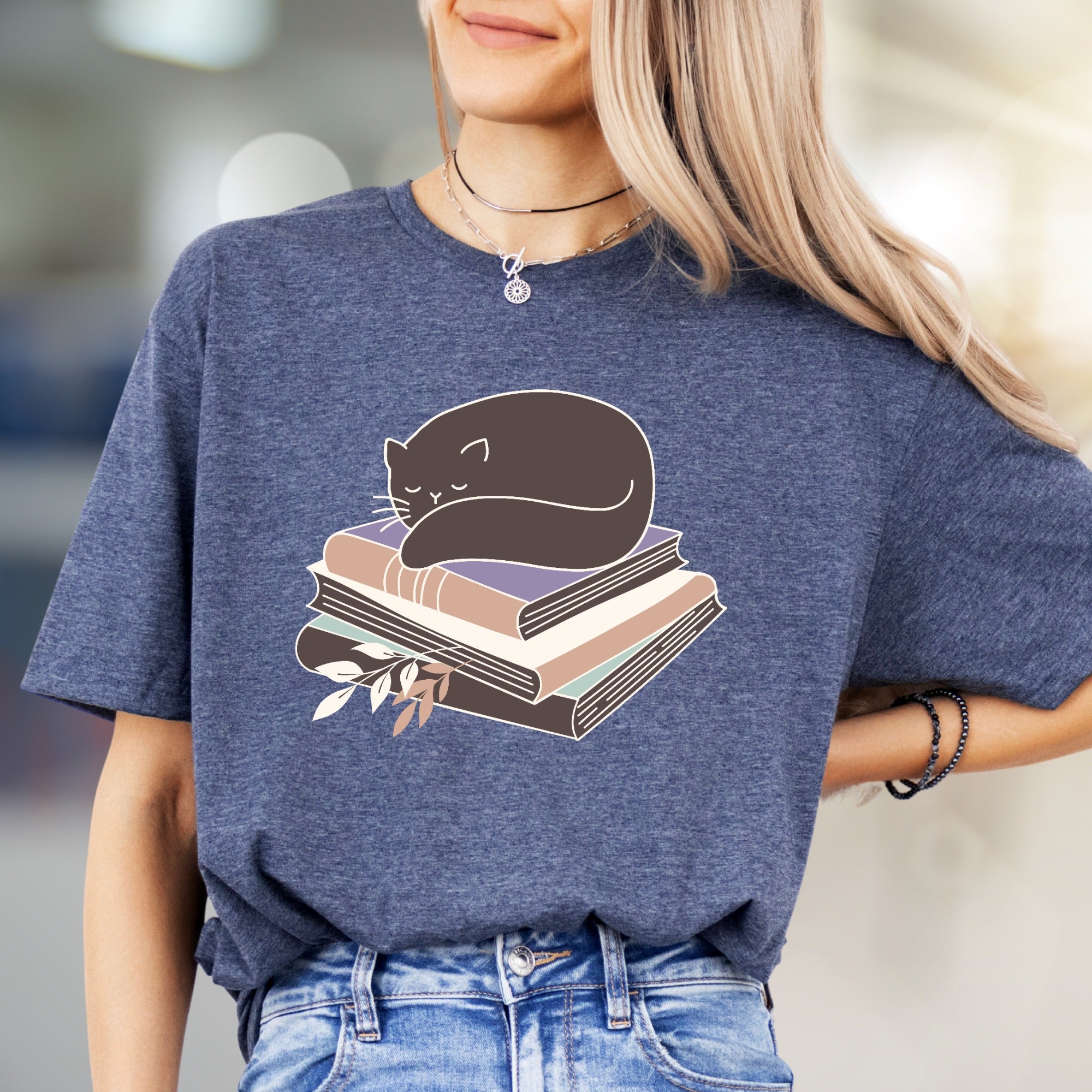 Sleeping Cat on Books Graphic Tee, a Cozy Literary Pick for Book Lovers