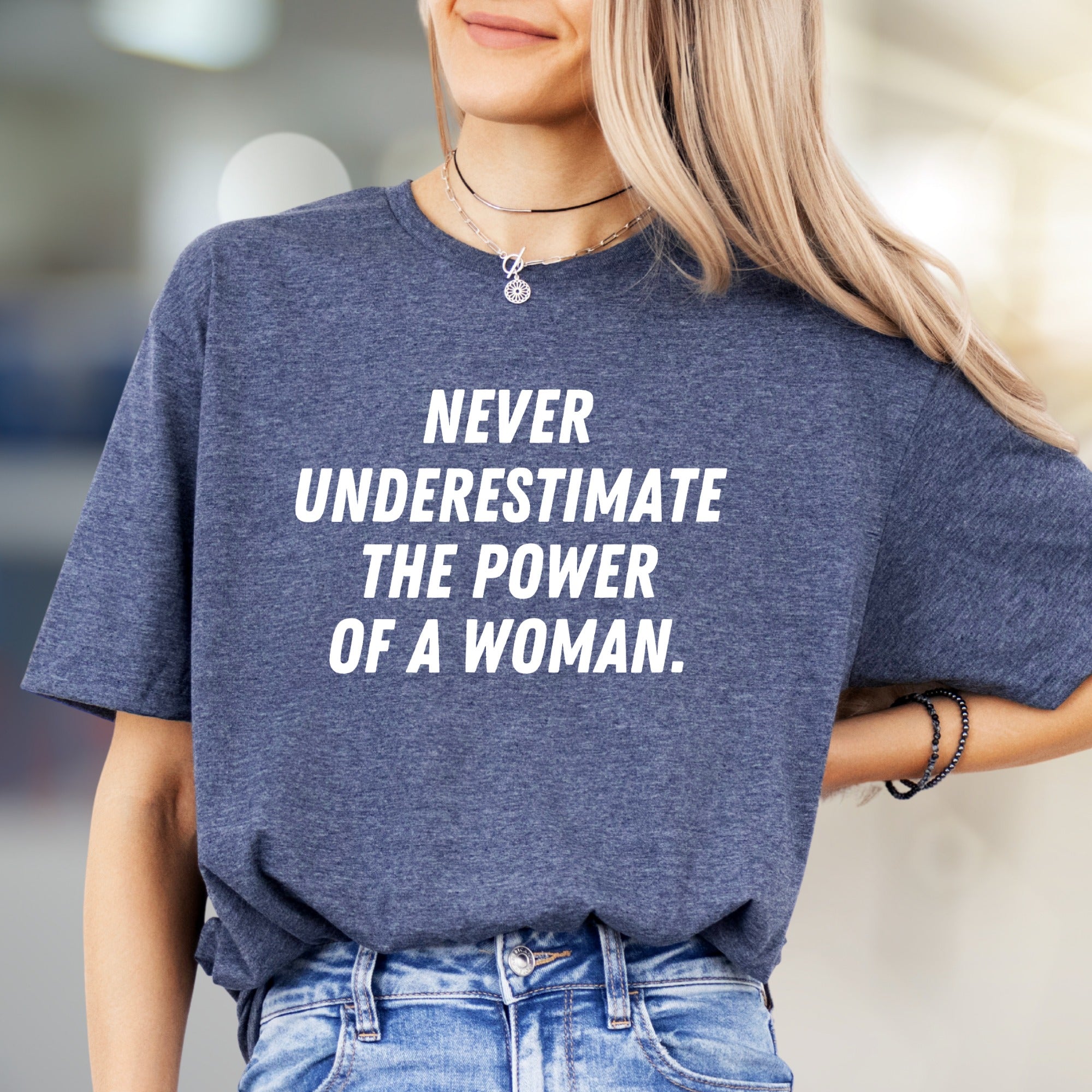 "NEVER UNDERESTIMATE THE POWER OF A WOMAN." Empowering Graphic Tee, a Bold Statement for Her