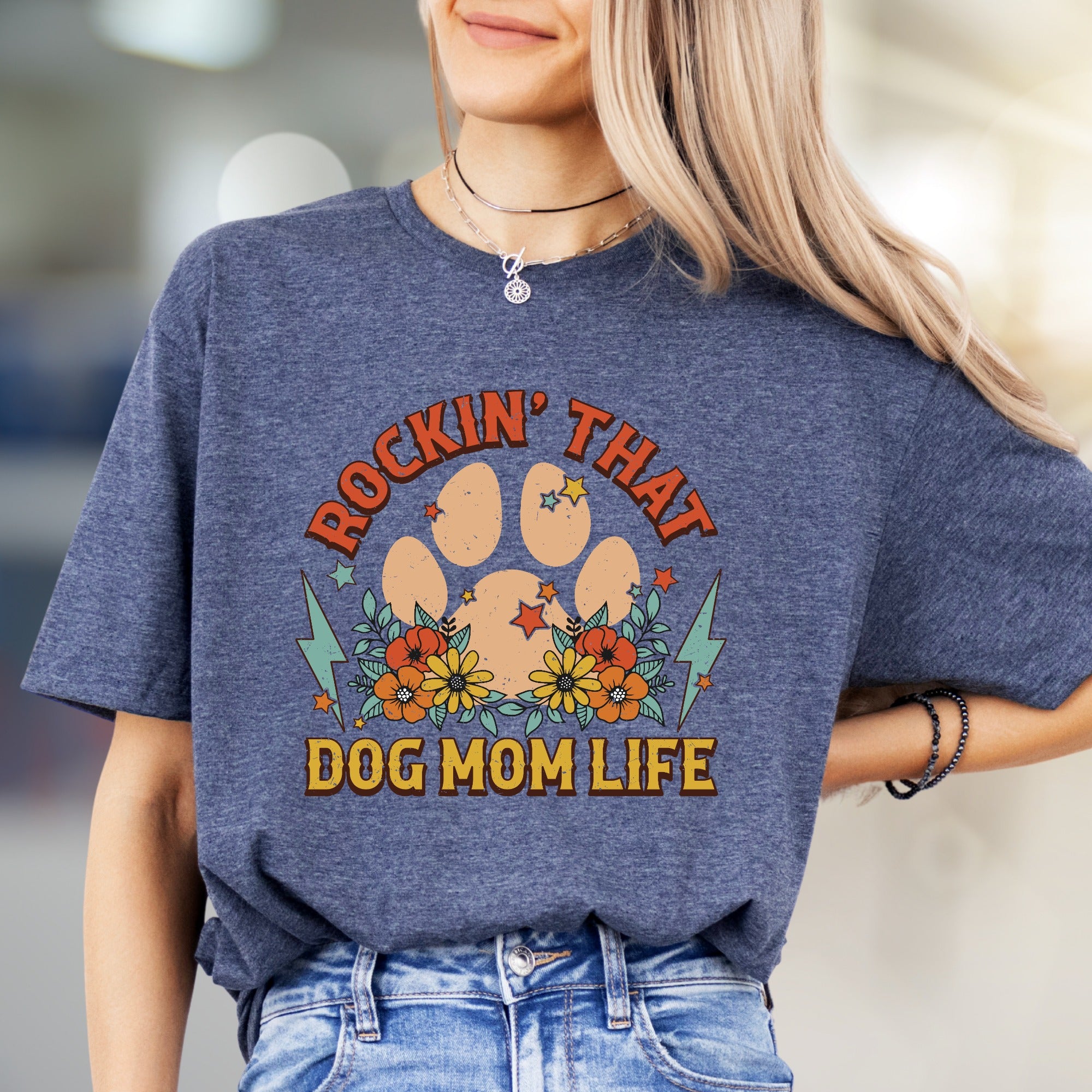 "ROCKIN' THAT DOG MOM LIFE" Retro Paw Print Graphic Tee, a Boho Chic Pick for Dog Lovers