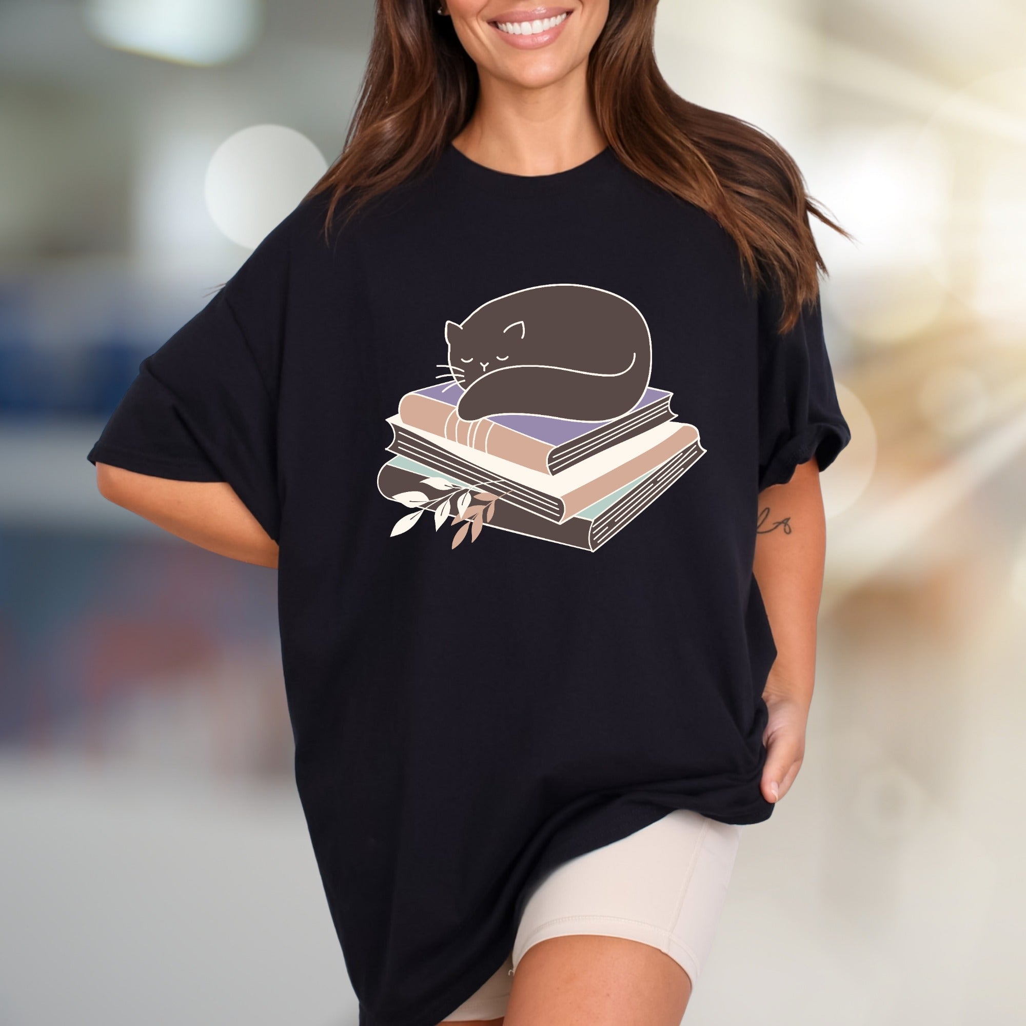 Sleeping Cat on Books Graphic Tee, a Cozy Literary Pick for Book Lovers