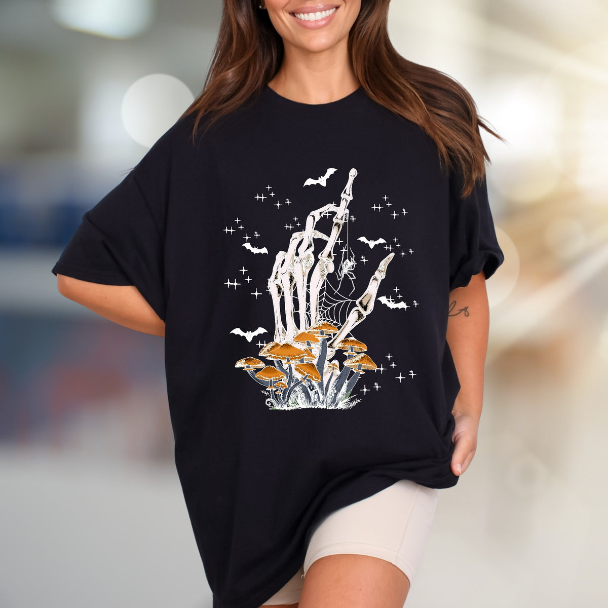 Skeleton Hand Mushroom Graphic Tee, a Spooky-Cute Pick for Halloween Lovers