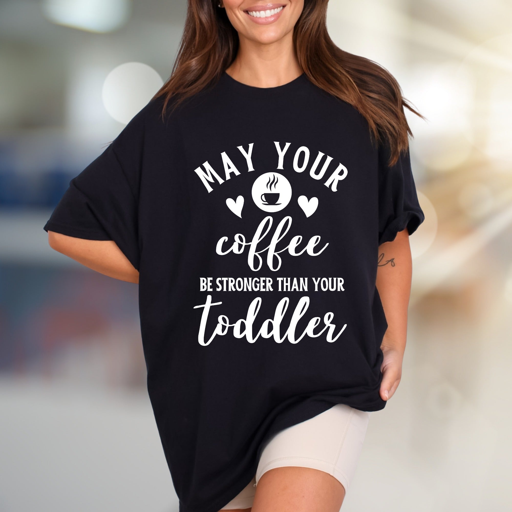 "May Your Coffee Be Stronger Than Your Toddler" Graphic Tee, a Parent Humor Pick for Coffee Lovers