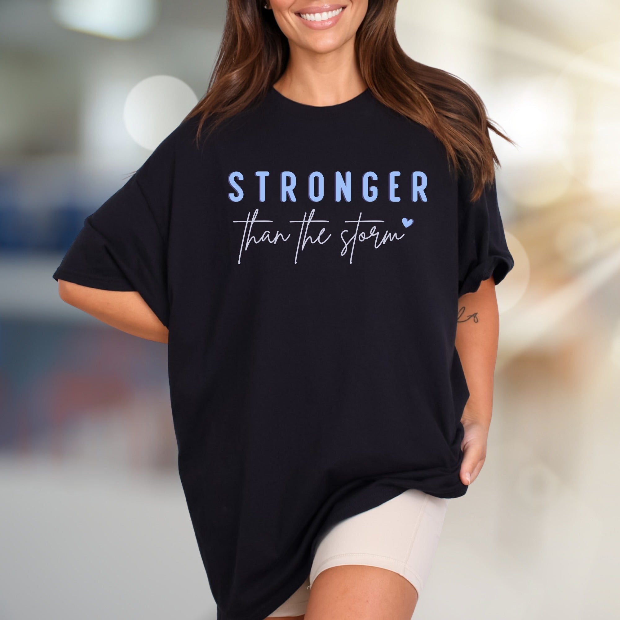 "STRONGER than the storm" Motivational Graphic Tee, an Uplifting Pick for Survivors