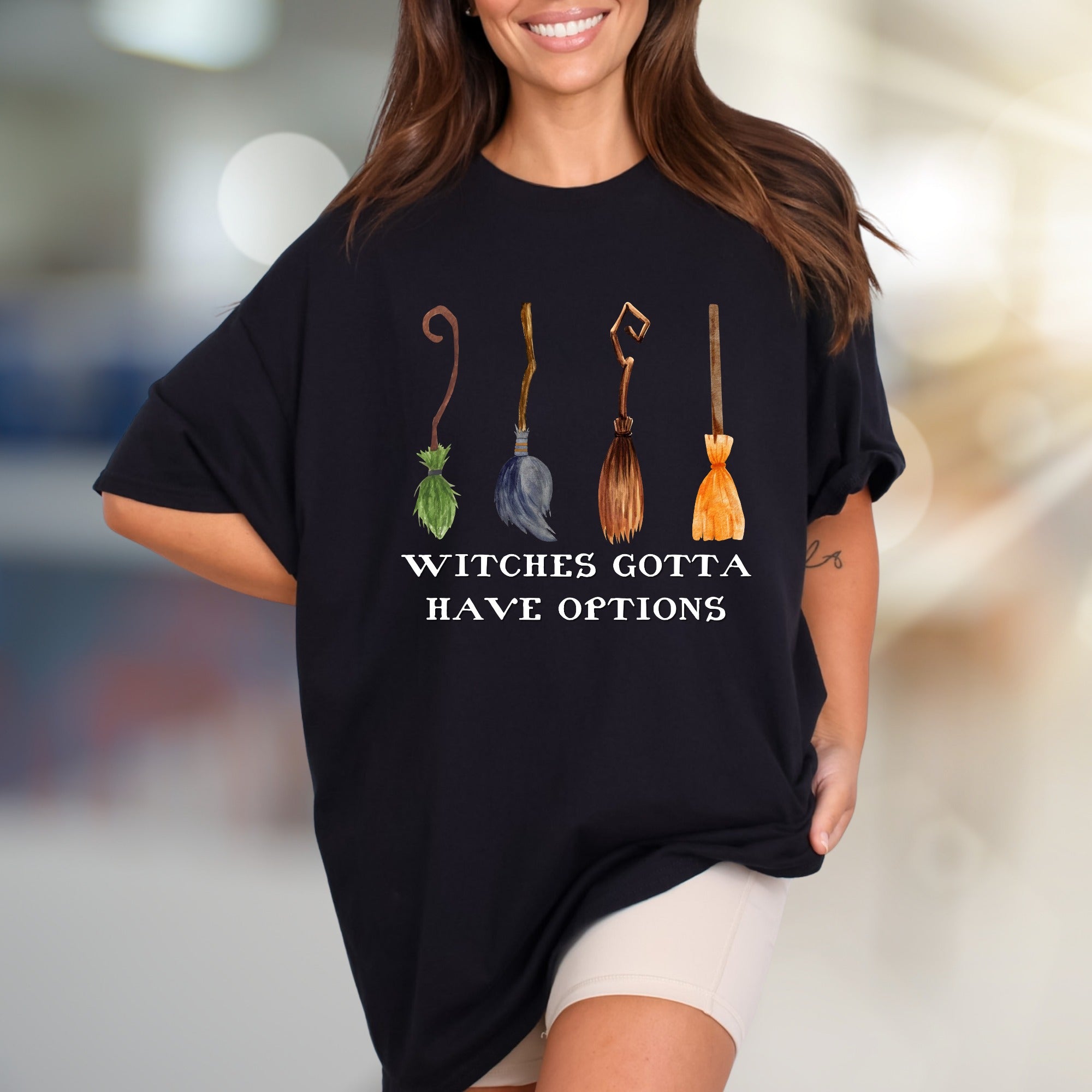 "Witches Gotta Have Options" Halloween Broomstick Graphic Unisex Tee, a Witchy Pick for Spooky Season Enthusiasts