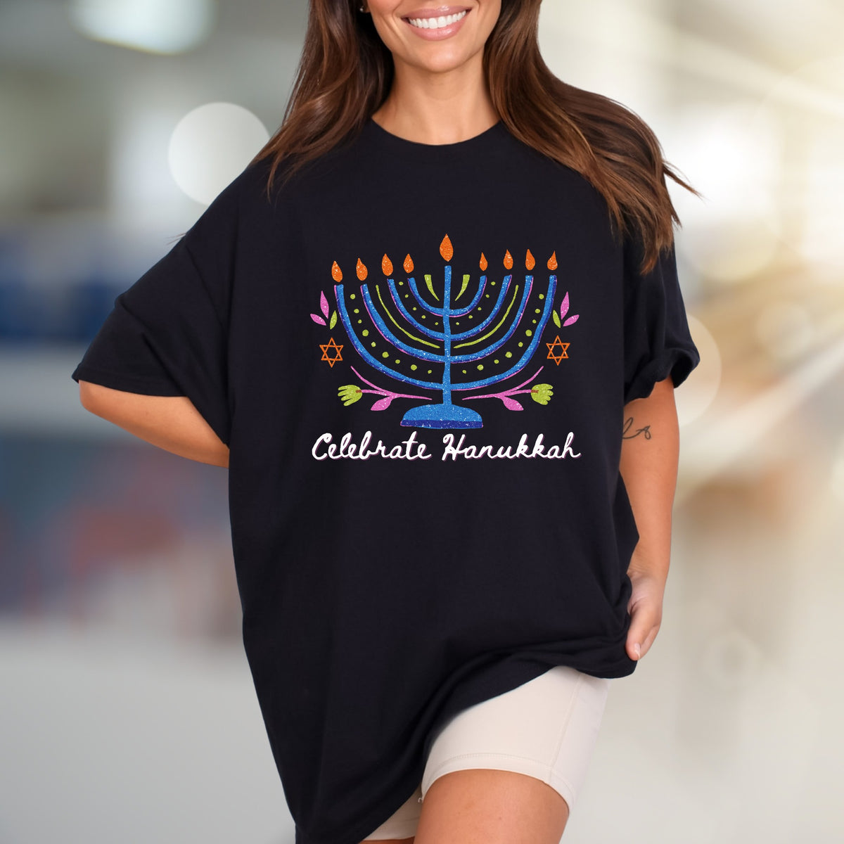 "Celebrate Hanukkah" Vibrant Menorah Graphic Tee, a Festive Holiday Pick for Enthusiasts