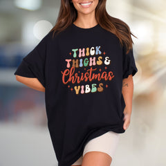 "Thick Thighs & Christmas Vibes" Retro Graphic Tee, a Festive Niche for Holiday Enthusiasts