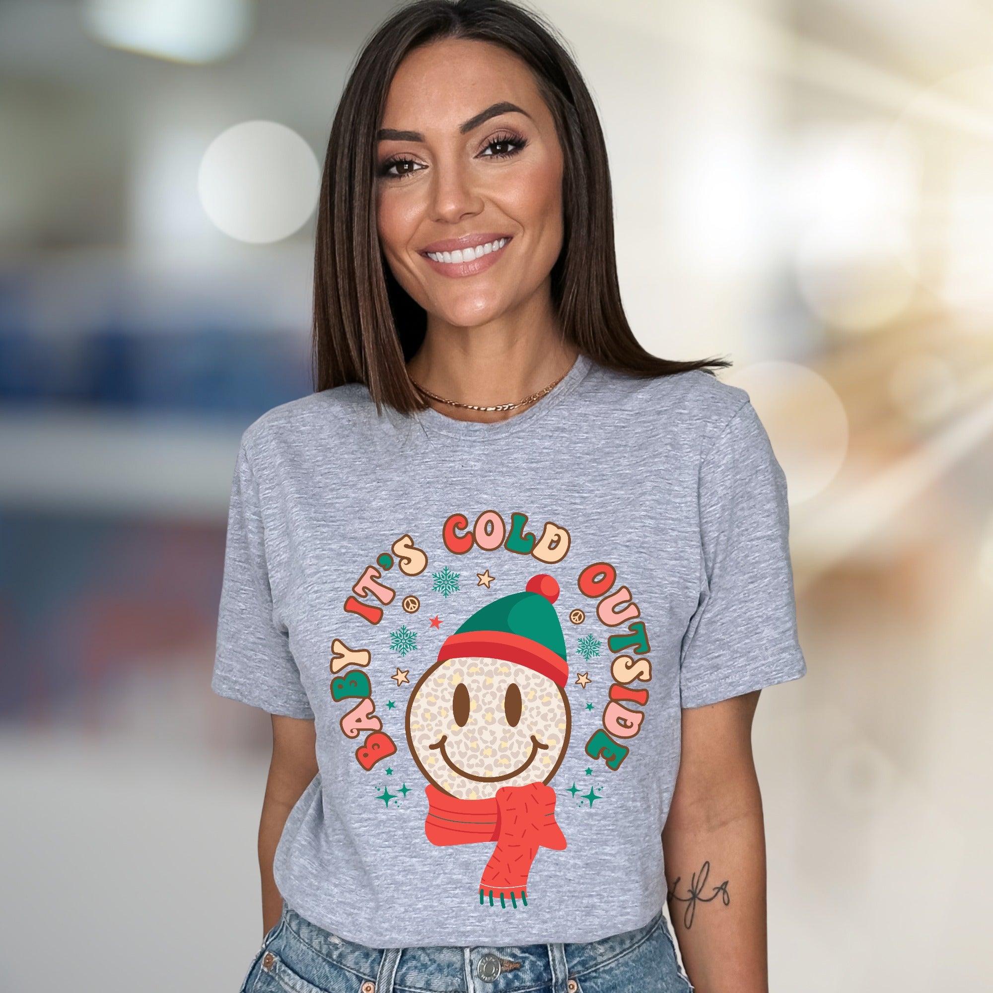 "Baby It's Cold Outside" Winter Smiley Graphic Tee, a Festive Comfort Pick for Holiday Lovers